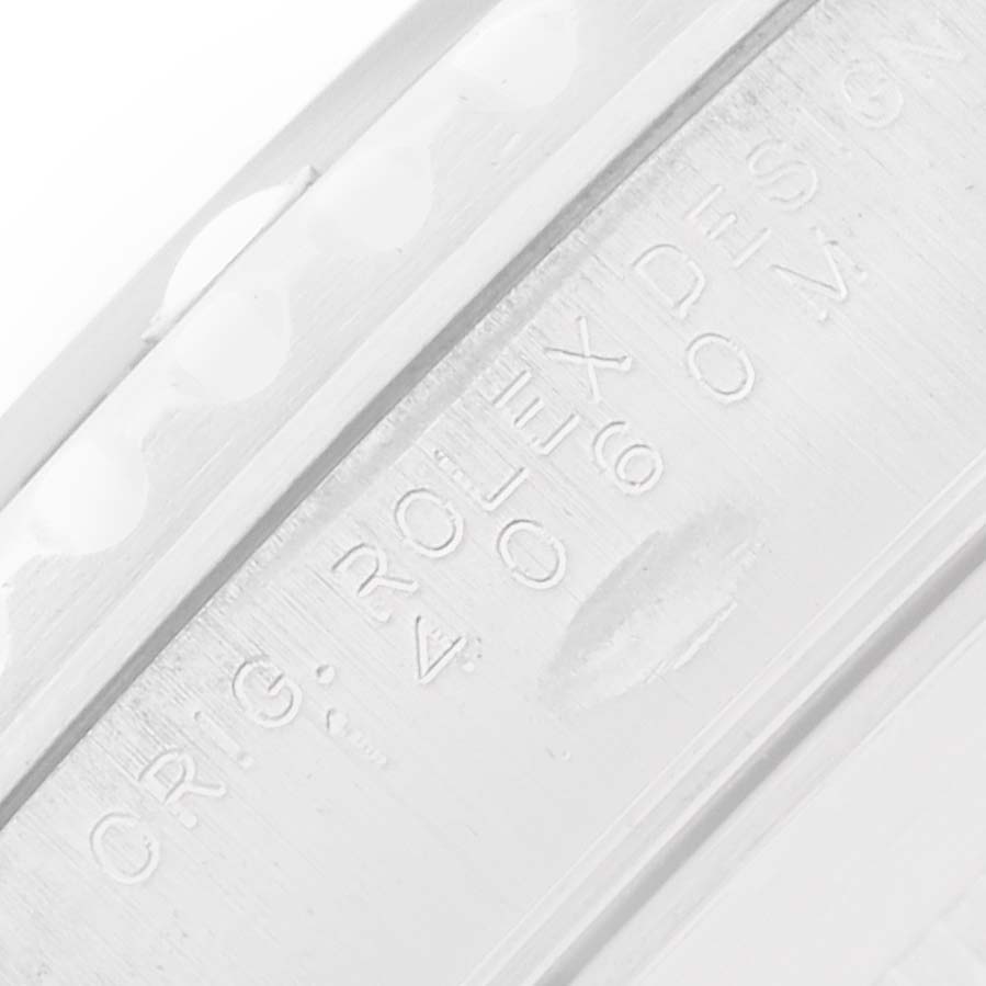 This image shows a close-up of the inner bezel with engravings on a Rolex Submariner 14060M Men
s Stainless Steel Black Dial watch.