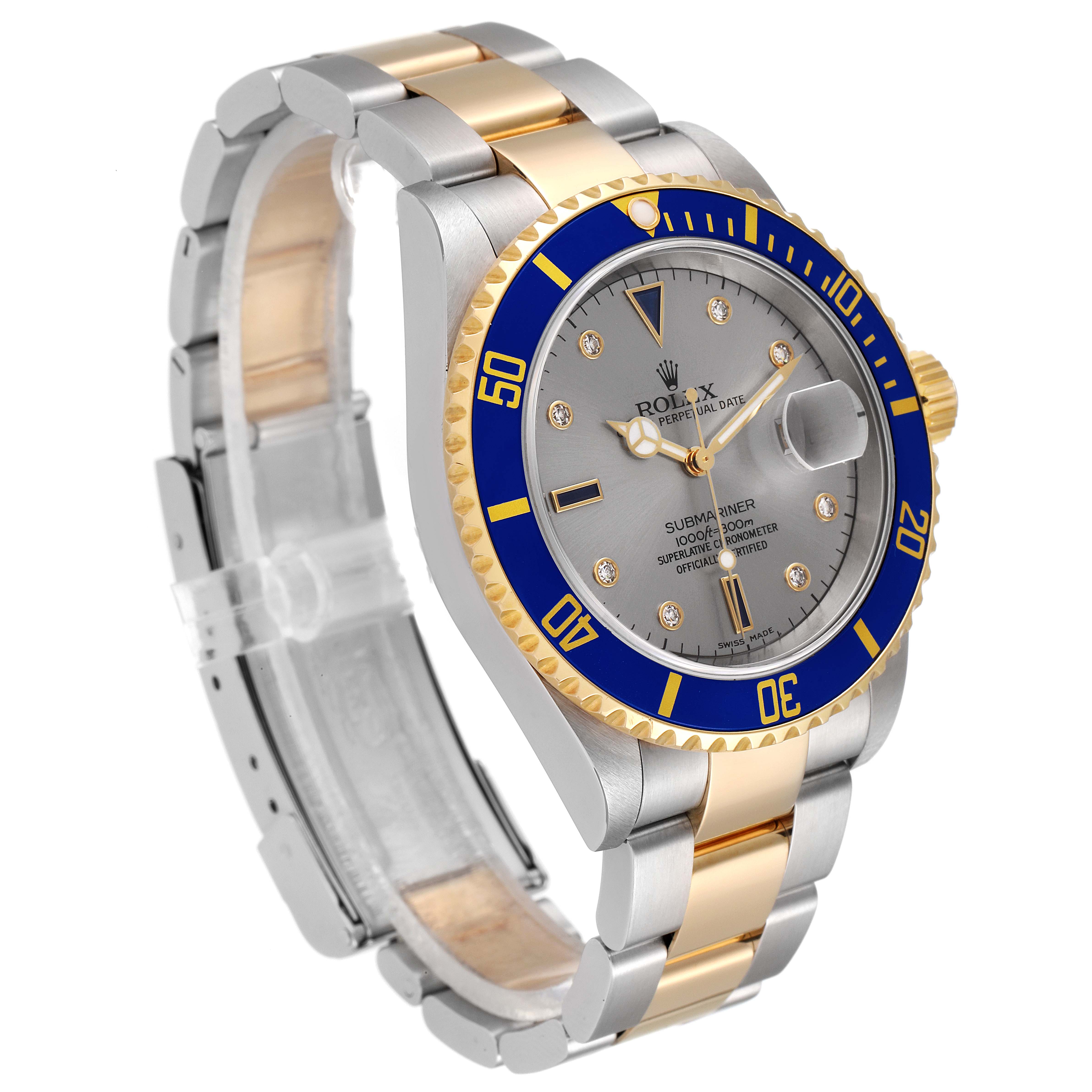 The image shows a Rolex Submariner 16613 Men
s Steel and Gold (two tone) Grey Dial 16613 Men
s Steel and Gold (two tone) Grey Dial watch at an angle displaying the face, bezel, crown, and part of the bracelet.