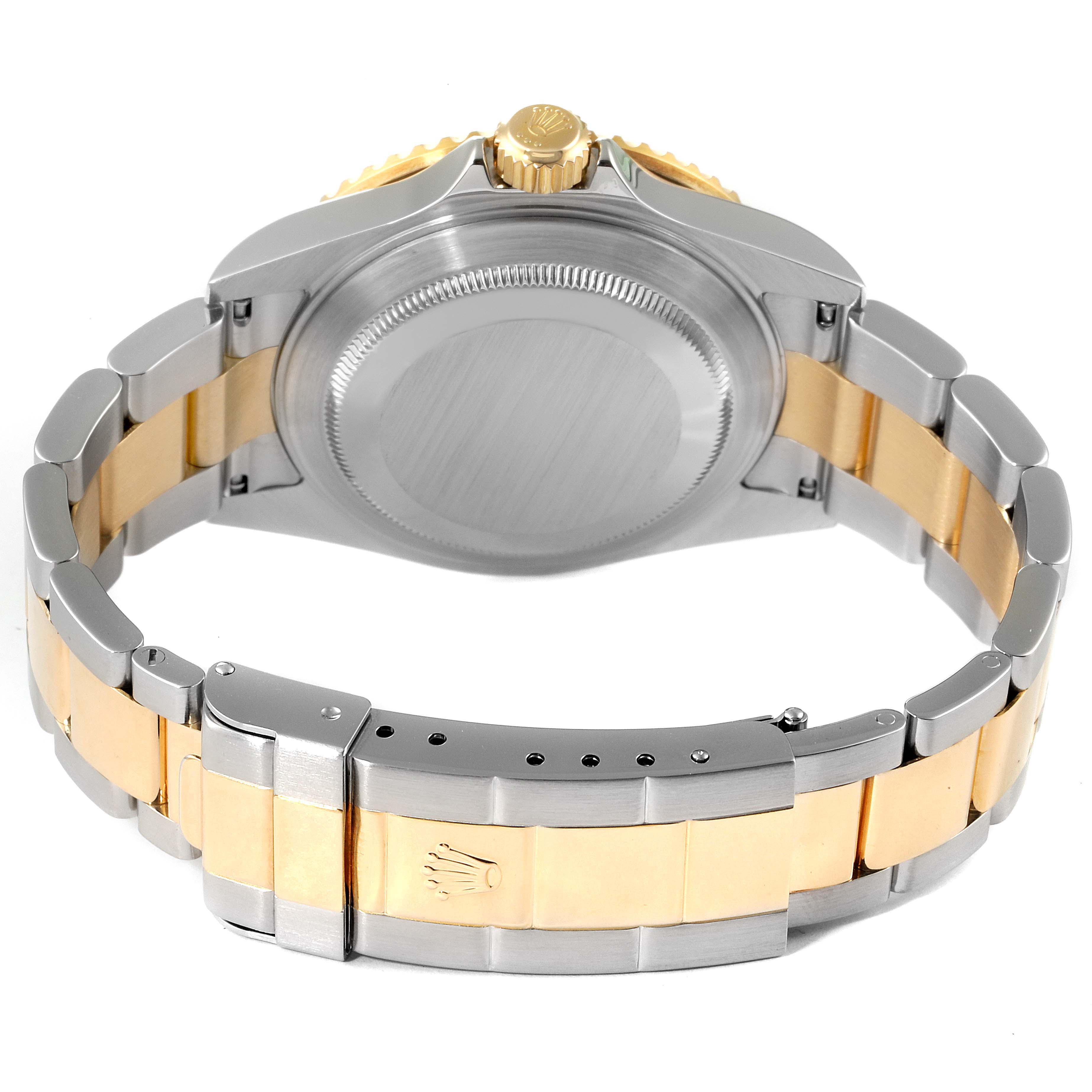 The image shows the back and sides of a Rolex Submariner 16613 Men
s Steel and Gold (two tone) Grey Dial 16613 Men
s Steel and Gold (two tone) Grey Dial watch case and its two-tone bracelet.