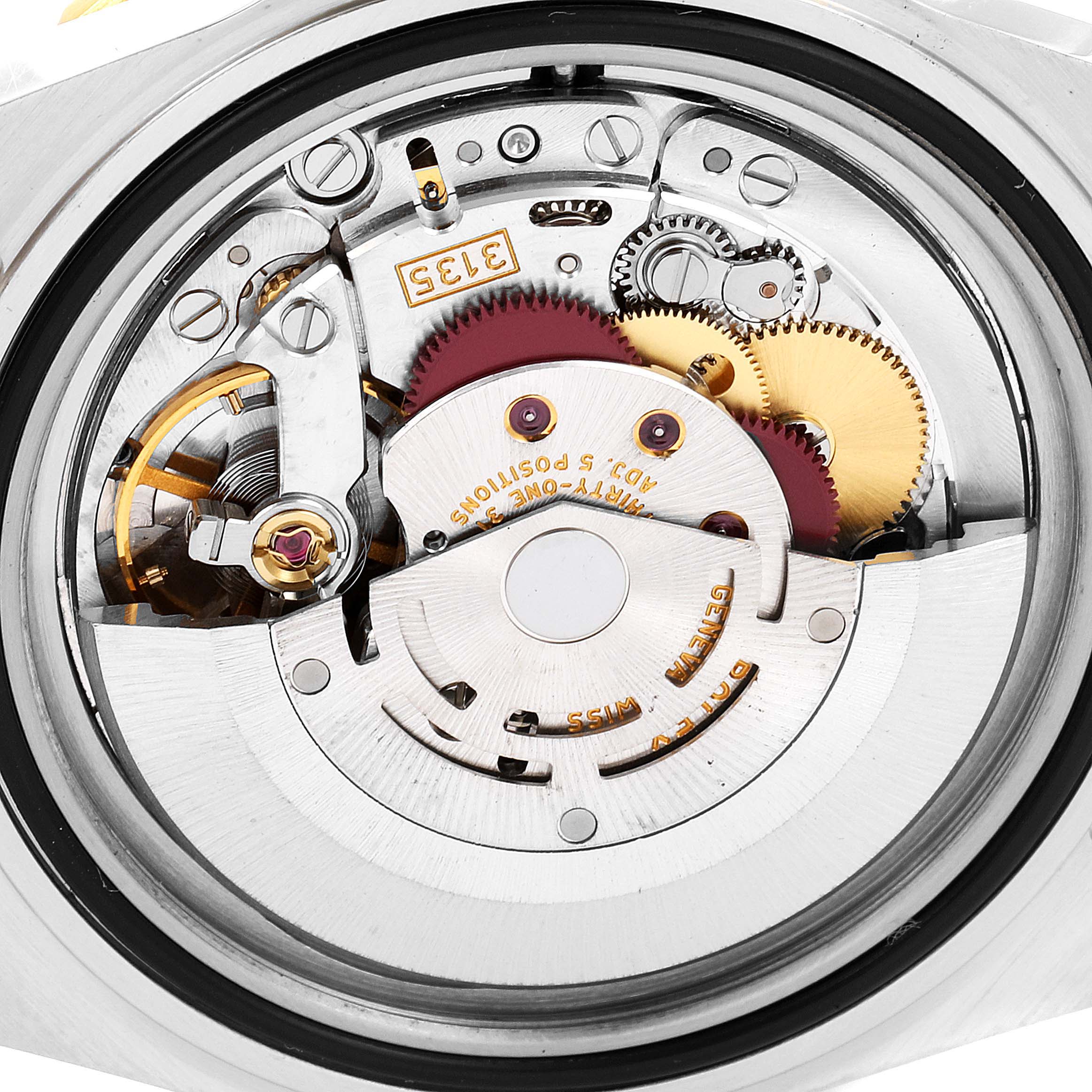 This image shows a close-up view of the movement and internal mechanics of a Rolex Submariner 16613 Men
s Steel and Gold (two tone) Grey Dial 16613 Men
s Steel and Gold (two tone) Grey Dial watch.