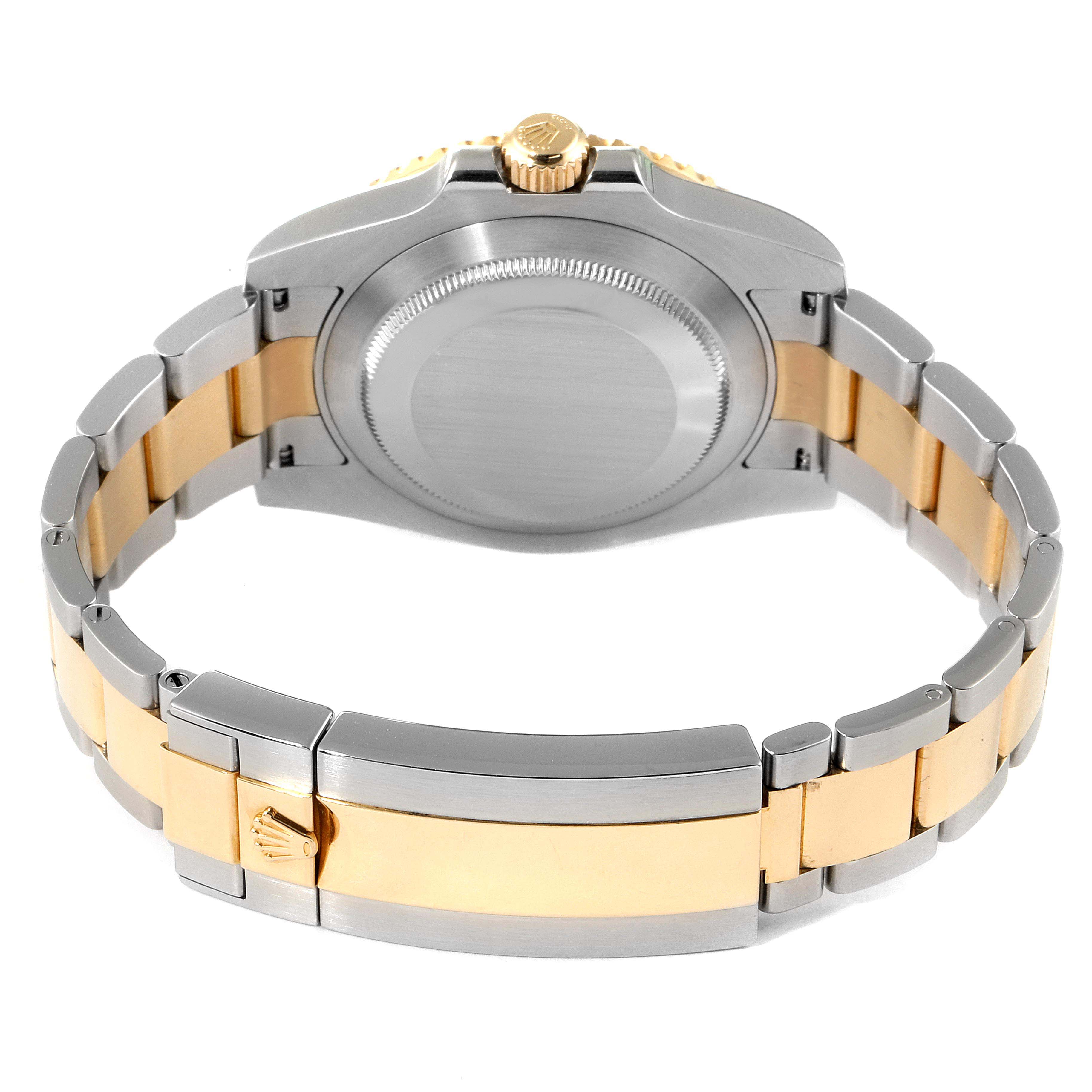 This image shows the back view of a Rolex Submariner 116613 Men's Steel and Gold (two tone) Black Dial 116613 Men's Steel and Gold (two tone) Black Dial watch, detailing the bracelet, clasp, and case back.