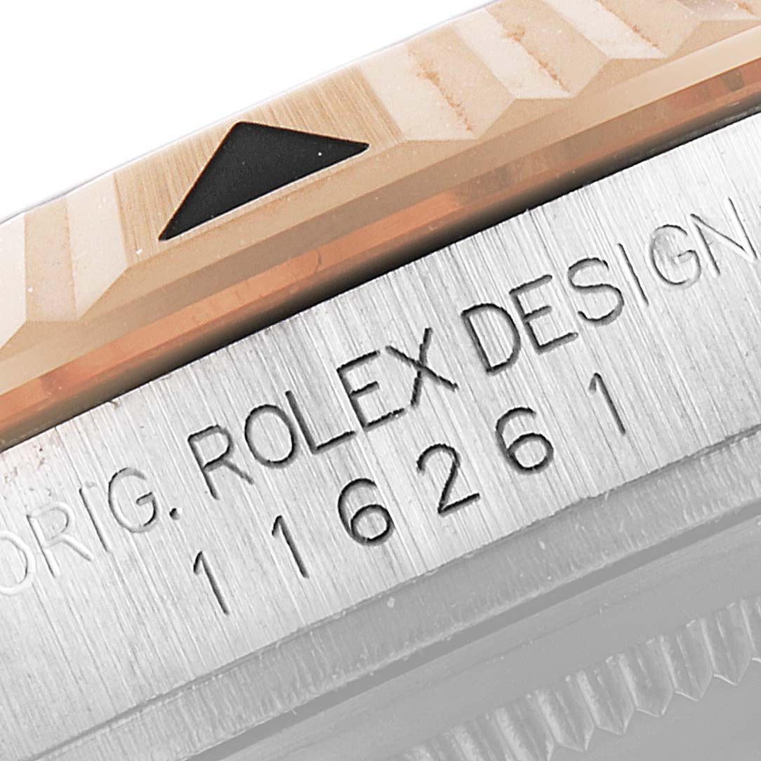 This image shows a close-up of the bezel and case of a Rolex Turn-o-Graph 116261 Men
s Steel and Gold (two tone) Black Dial 116261 Men
s Steel and Gold (two tone) Black Dial watch, highlighting the model number and "ROLEX DESIGN" inscription.
