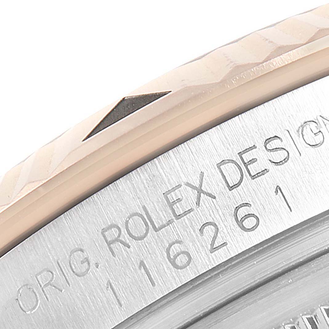This close-up image shows the bezel and serial number area of a Rolex Turn-o-Graph 116261 Men's Steel and Gold (two tone) Silver Dial 116261 Men's Steel and Gold (two tone) Silver Dial watch.