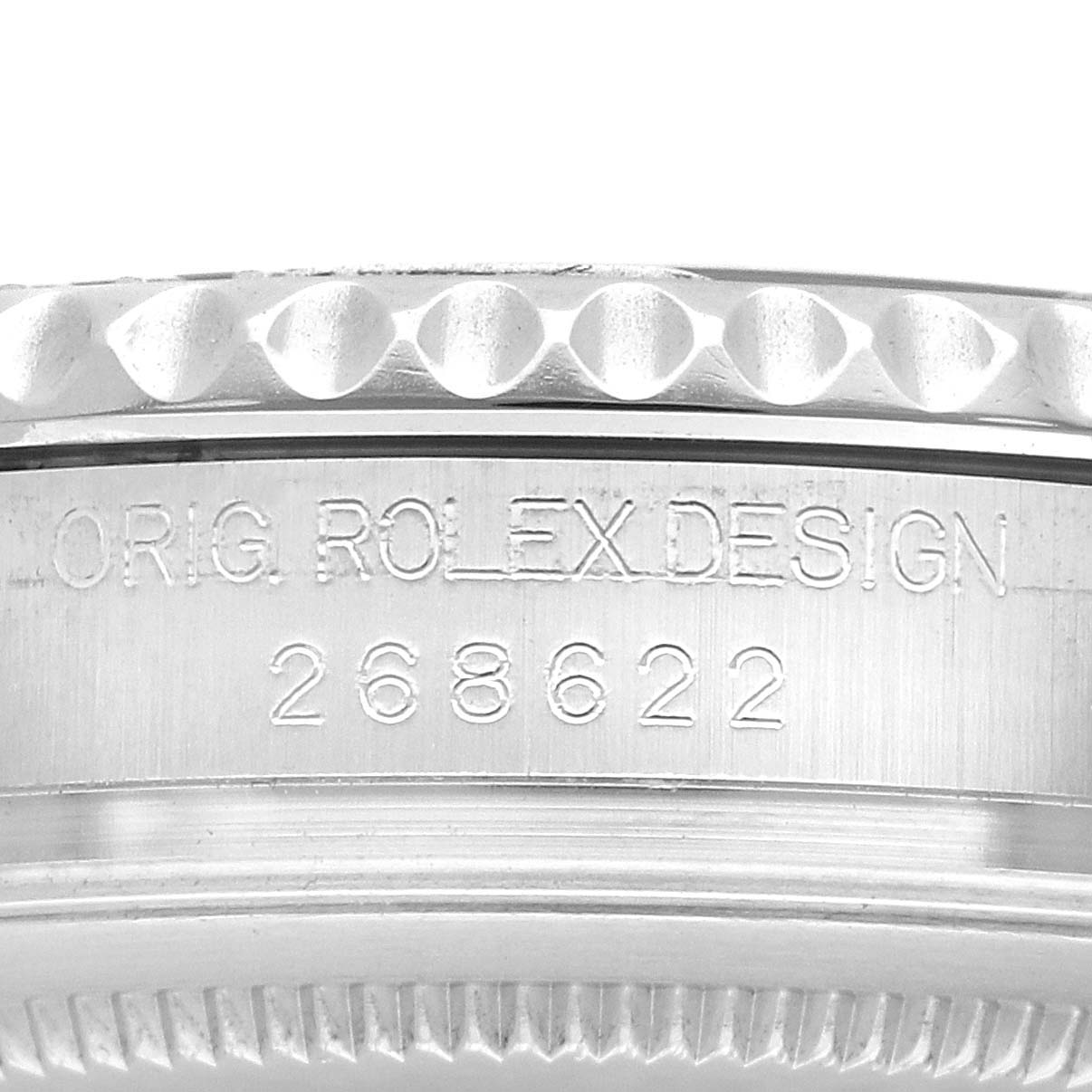 The image shows the side of a Rolex Yacht-Master 268622 Men
s Platinum Grey Dial watch bezel with engraved model details.