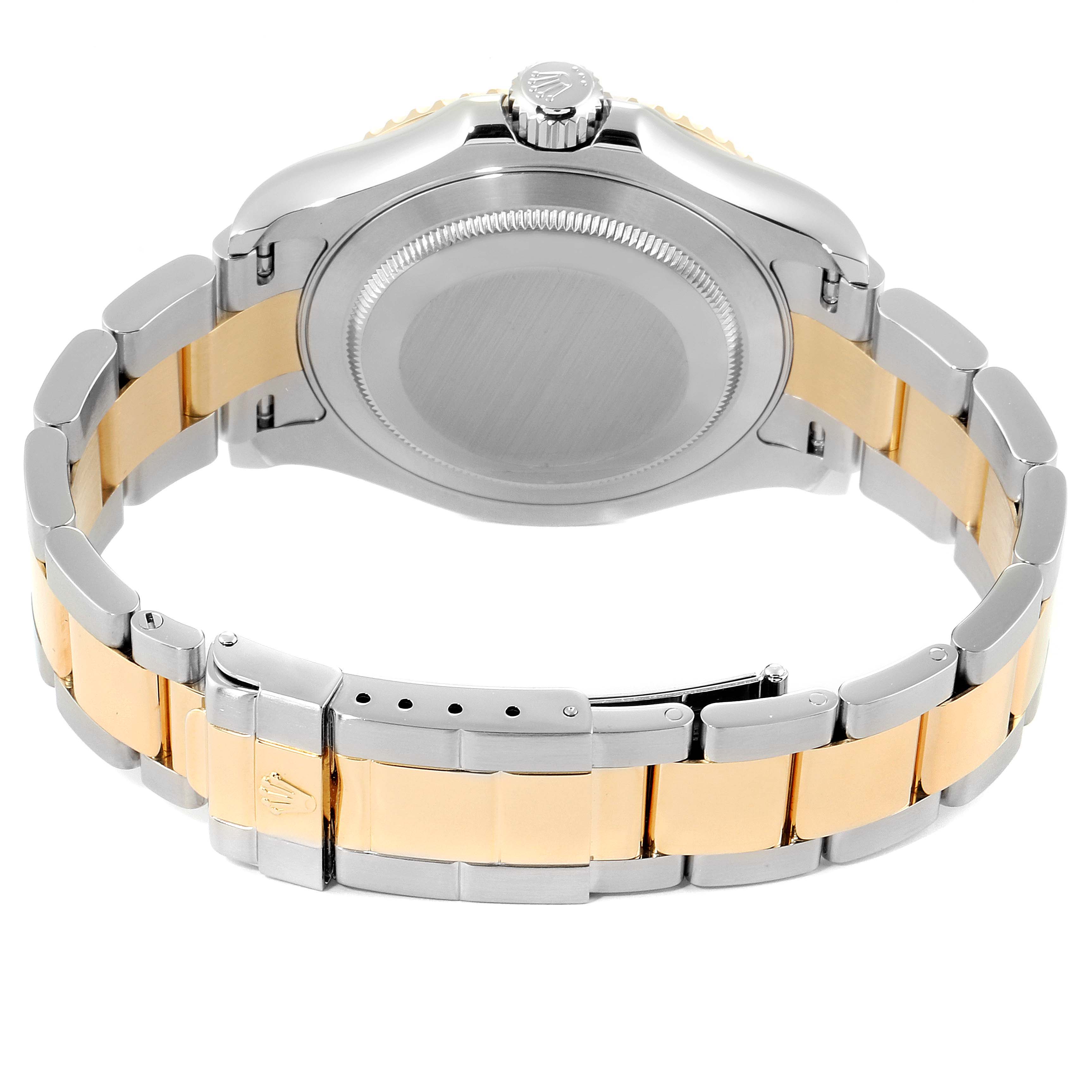 The image shows the back of a Rolex Yacht-Master 16623 Men's Steel and Gold (two tone) Mother of Pearl Dial 16623 Men's Steel and Gold (two tone) Mother of Pearl Dial watch, featuring its case, crown, and two-tone bracelet.