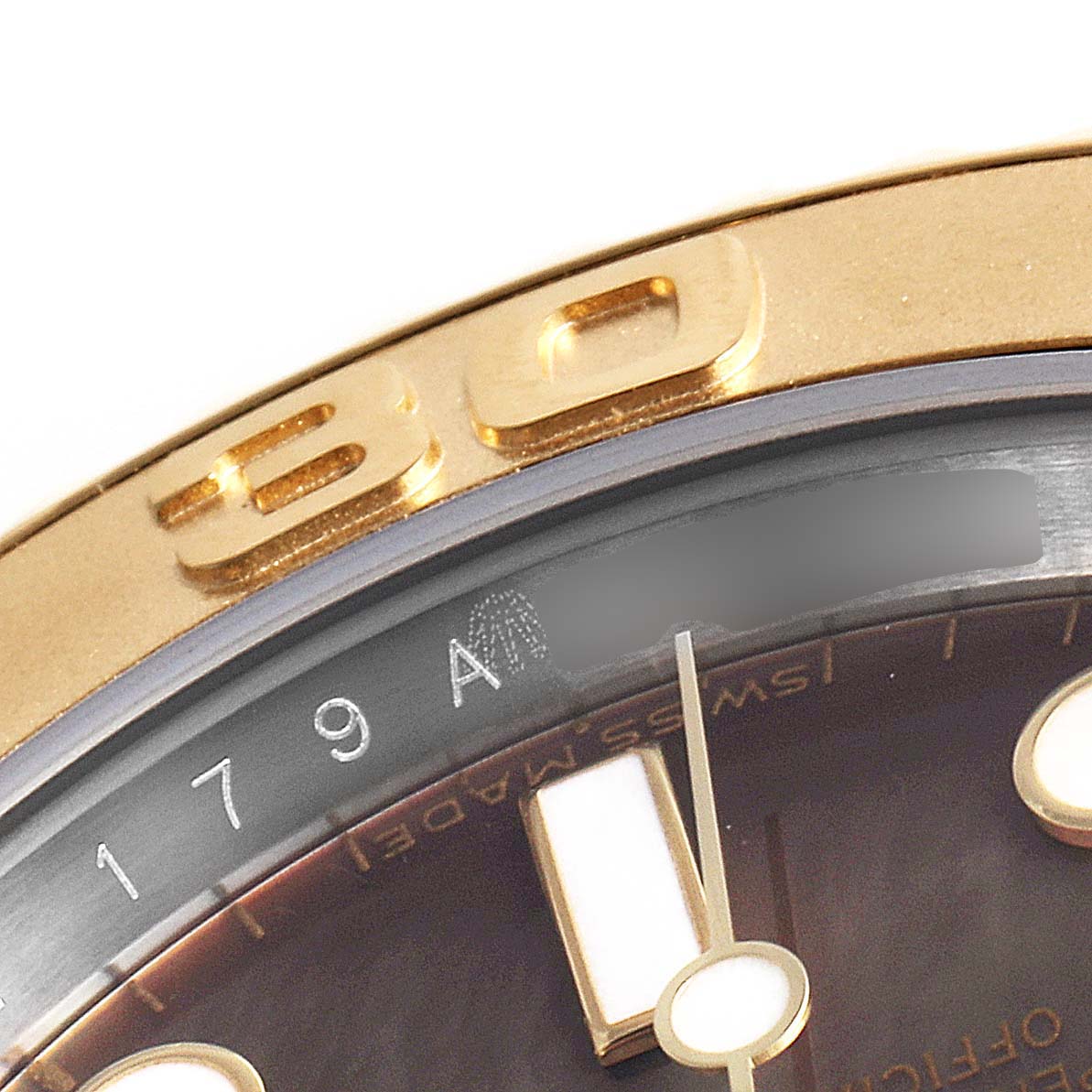 The image shows a close-up of the Rolex Yacht-Master 16623 Men's Steel and Gold (two tone) Mother of Pearl Dial 16623 Men's Steel and Gold (two tone) Mother of Pearl Dial's bezel, part of the dial, and serial number.