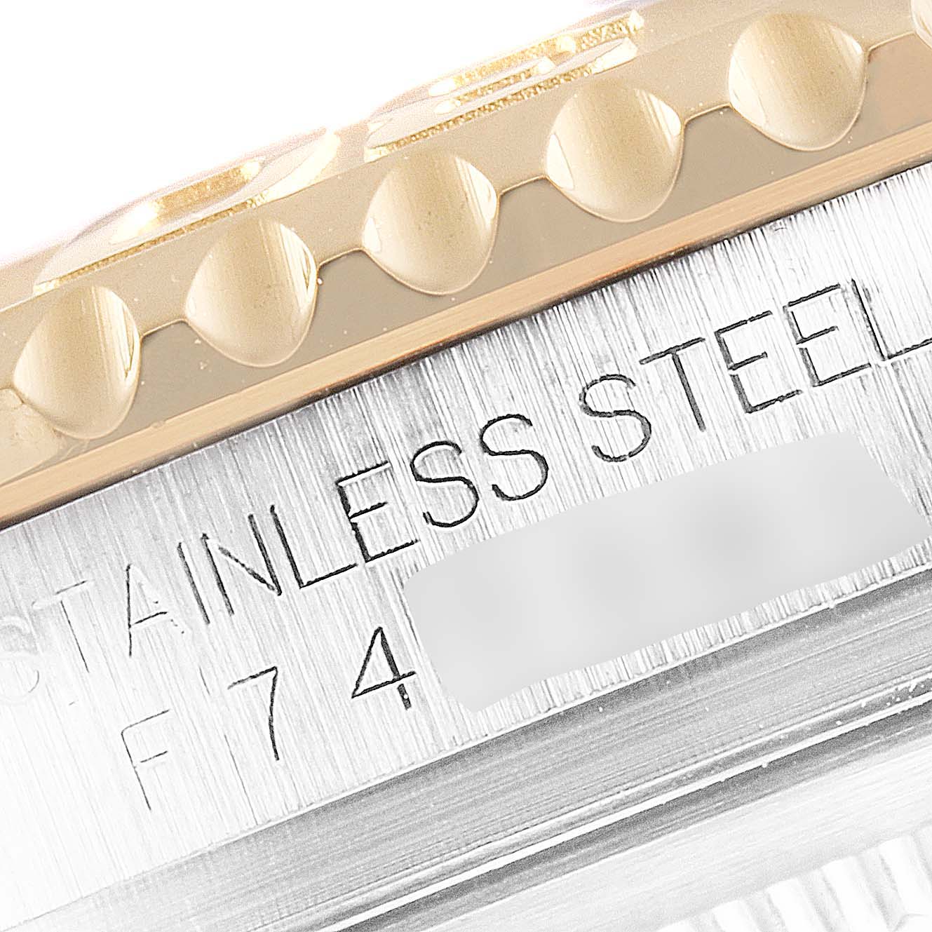 This close-up image shows the bezel and side engraving of a Rolex Yacht-Master 16623 Men's Steel and Gold (two tone) Mother of Pearl Dial 16623 Men's Steel and Gold (two tone) Mother of Pearl Dial watch, highlighting the material and serial number.