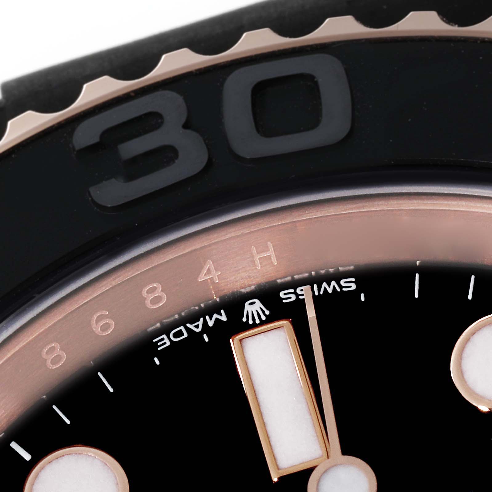 This close-up image shows the bezel and part of the dial of the Rolex Yacht-Master 126655 Men's Rose Gold Black Dial 126655 Men's Rose Gold Black Dial watch.