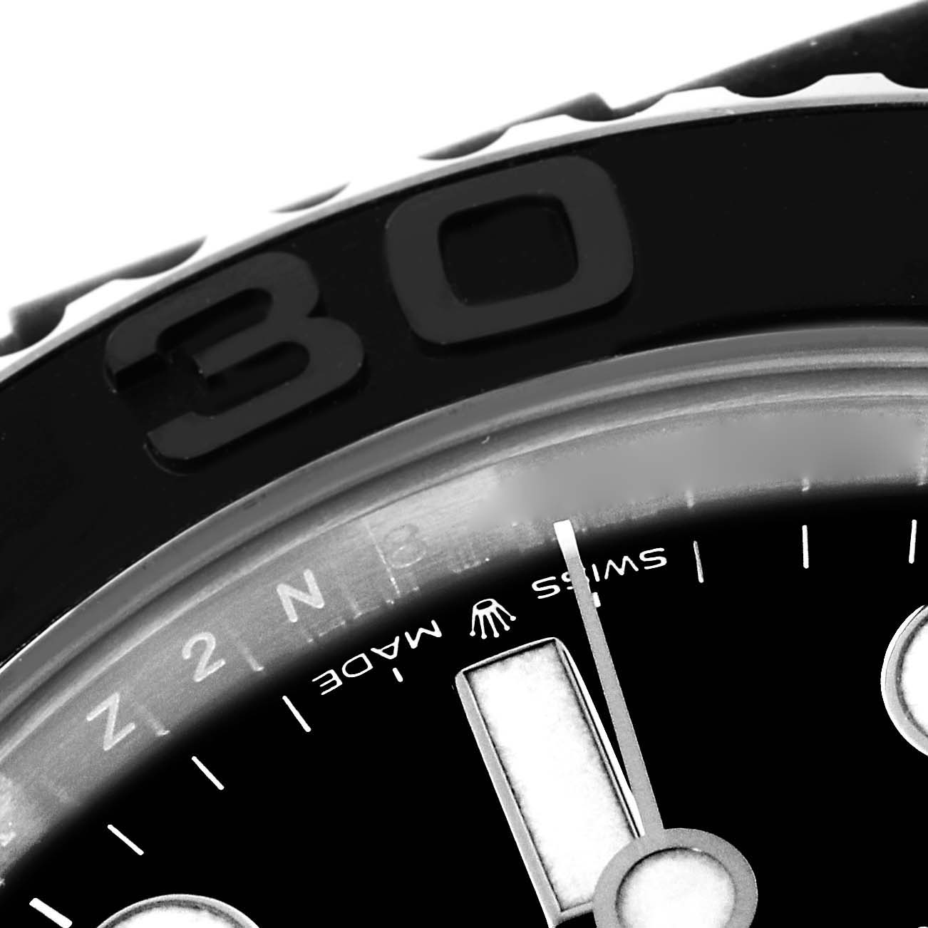 This close-up angle shows the bezel and part of the dial of a Rolex Yacht-Master 226659 Men
s Stainless Steel Black Dial 226659 Men
s Stainless Steel Black Dial watch, including hour markers and the "Swiss Made" text.
