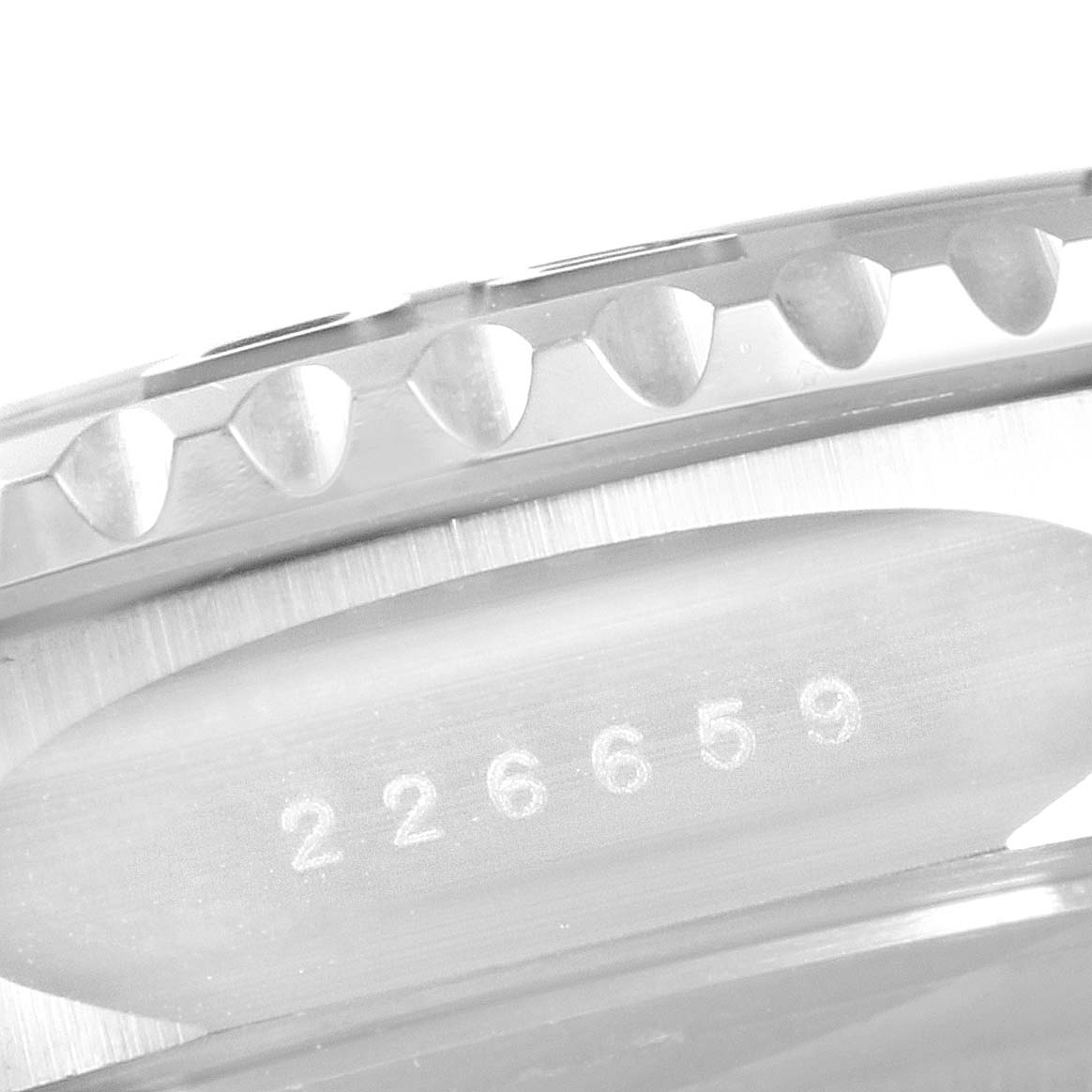 This image shows a close-up view of the side of the Rolex Yacht-Master 226659 Men
s Stainless Steel Black Dial 226659 Men
s Stainless Steel Black Dial, focusing on the bezel edge and a part of the serial number.