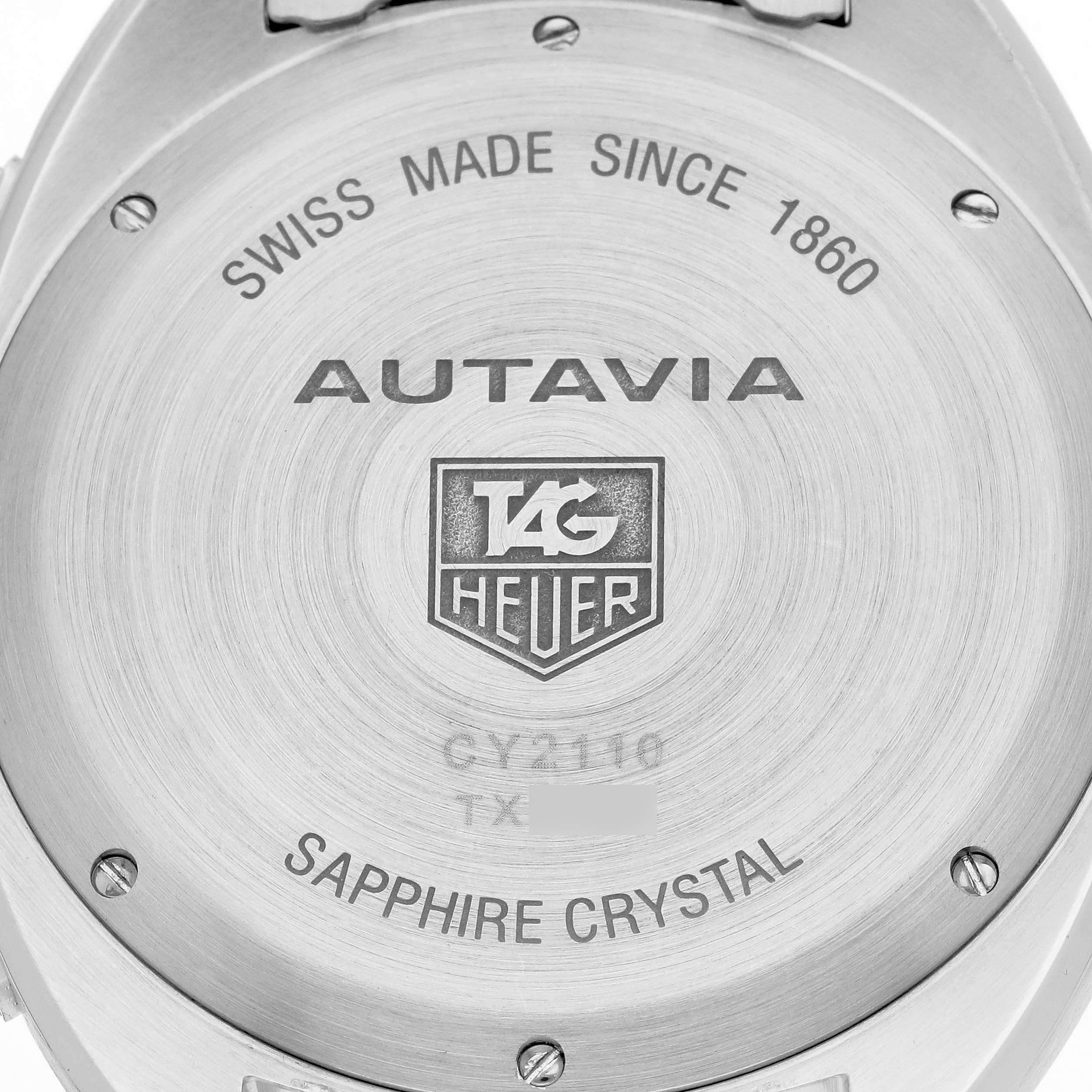 The image shows the back casing of a Tag Heuer Autavia CY2110 Men
s Stainless Steel White Dial watch with engraved details.