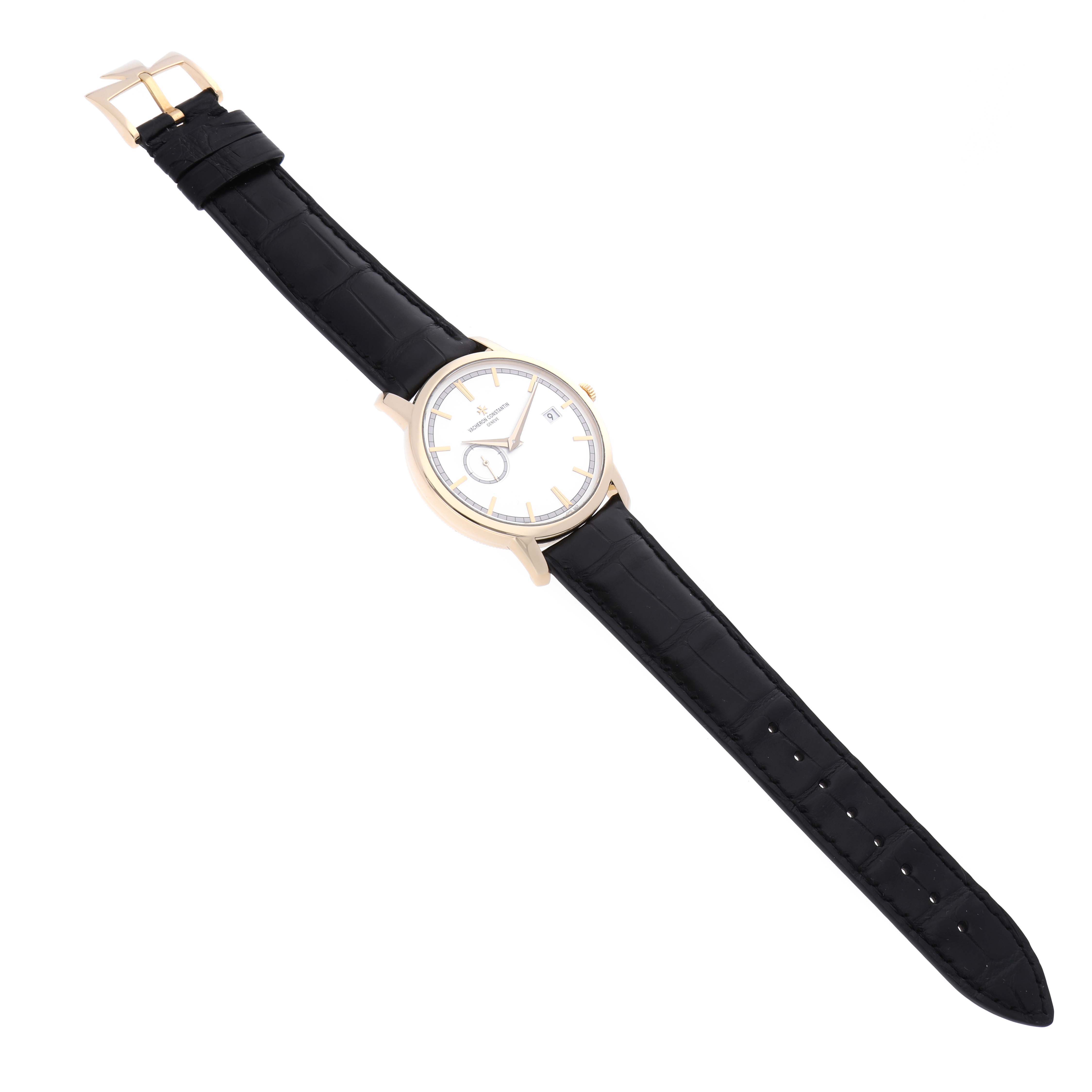 The Vacheron Constantin Traditionnelle 87172/000J Men's Yellow Gold Silver Dial 87172/000J Men's Yellow Gold Silver Dial watch is shown from an overhead angle, highlighting its face, case, and black leather strap.