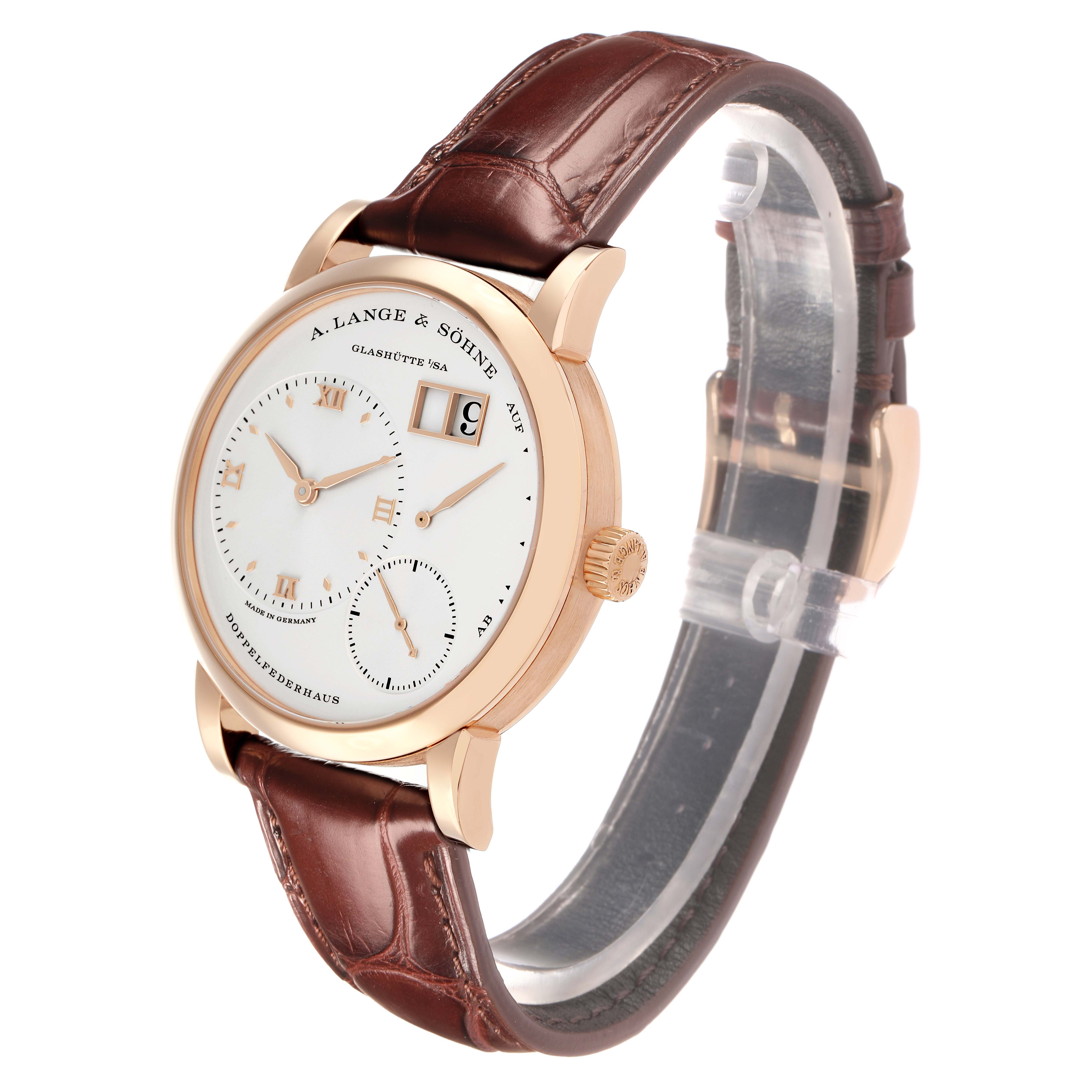The image shows a side angle view of the A. Lange 
Sohne Lange 1 191.032 Men
s Rose Gold Silver Dial watch, highlighting the case, dial, crown, and leather strap.