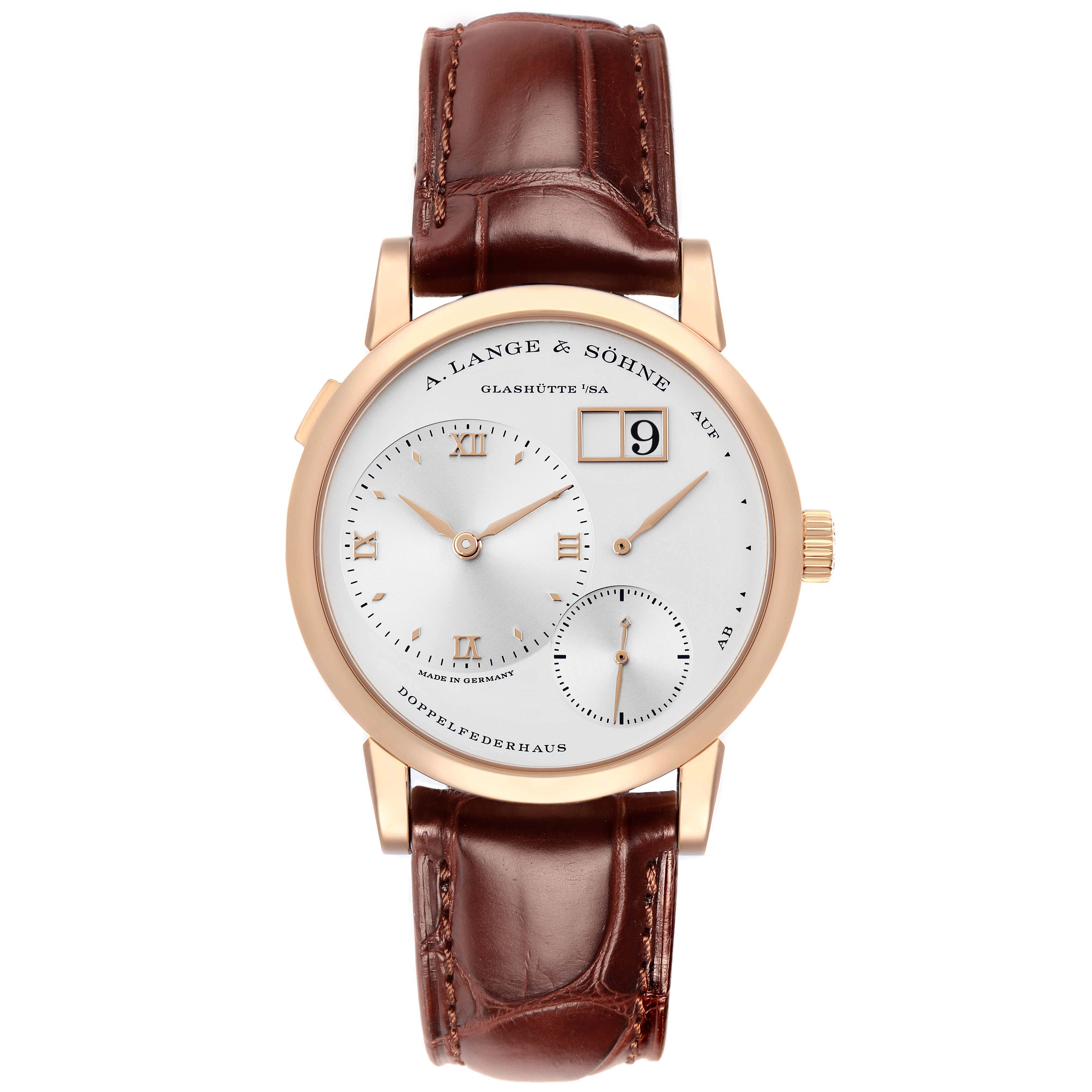 The A. Lange 
Sohne Lange 1 191.032 Men
s Rose Gold Silver Dial watch is shown from a straight-on angle, displaying the dial, leather strap, and crown.