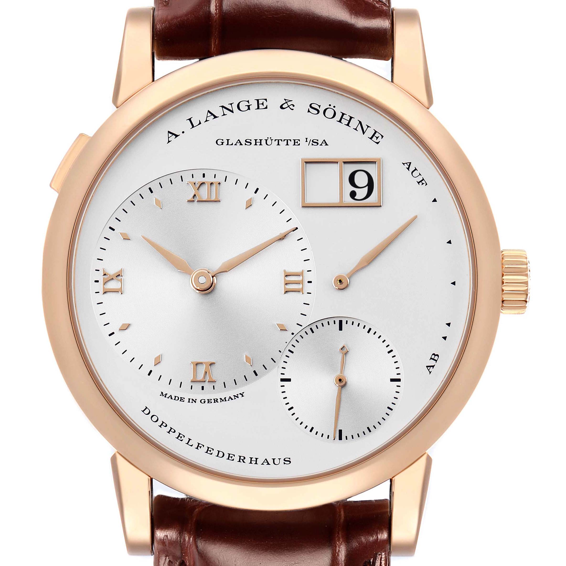 The A. Lange 
Sohne Lange 1 191.032 Men
s Rose Gold Silver Dial watch is shown from the front, displaying its dial, hands, and leather strap attachment.