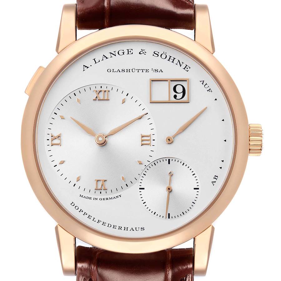 The A. Lange & Sohne Lange 1 191.032 Men's Rose Gold Silver Dial watch is shown from the front, displaying its dial, hands, and leather strap attachment.