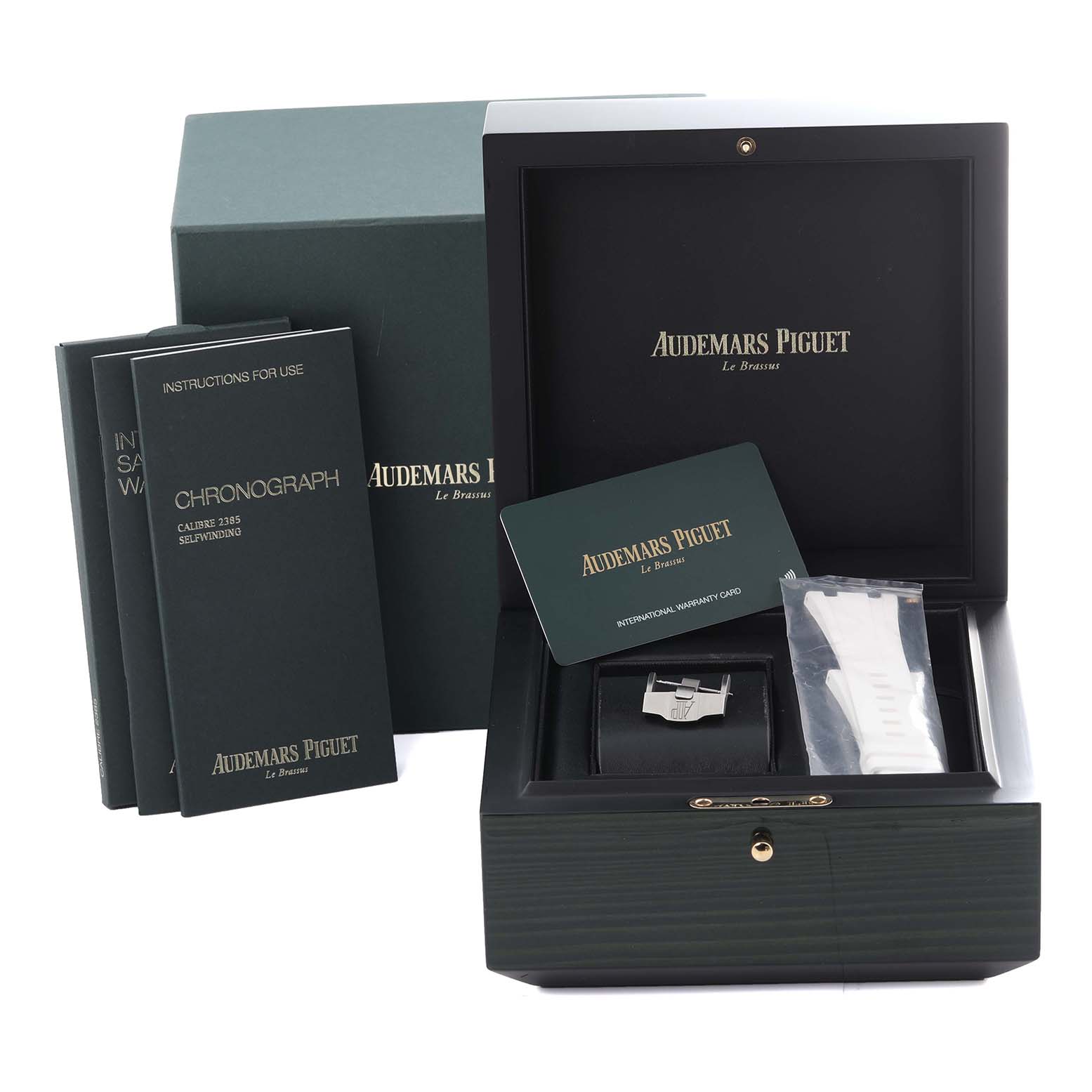 This image shows the external box, manual, warranty card, and watch cushions for an Audemars Piguet Royal Oak 26480TI.OO.A027CA.01 Men's Titanium Blue Dial 26480TI.OO.A027CA.01 Men's Titanium Blue Dial model.