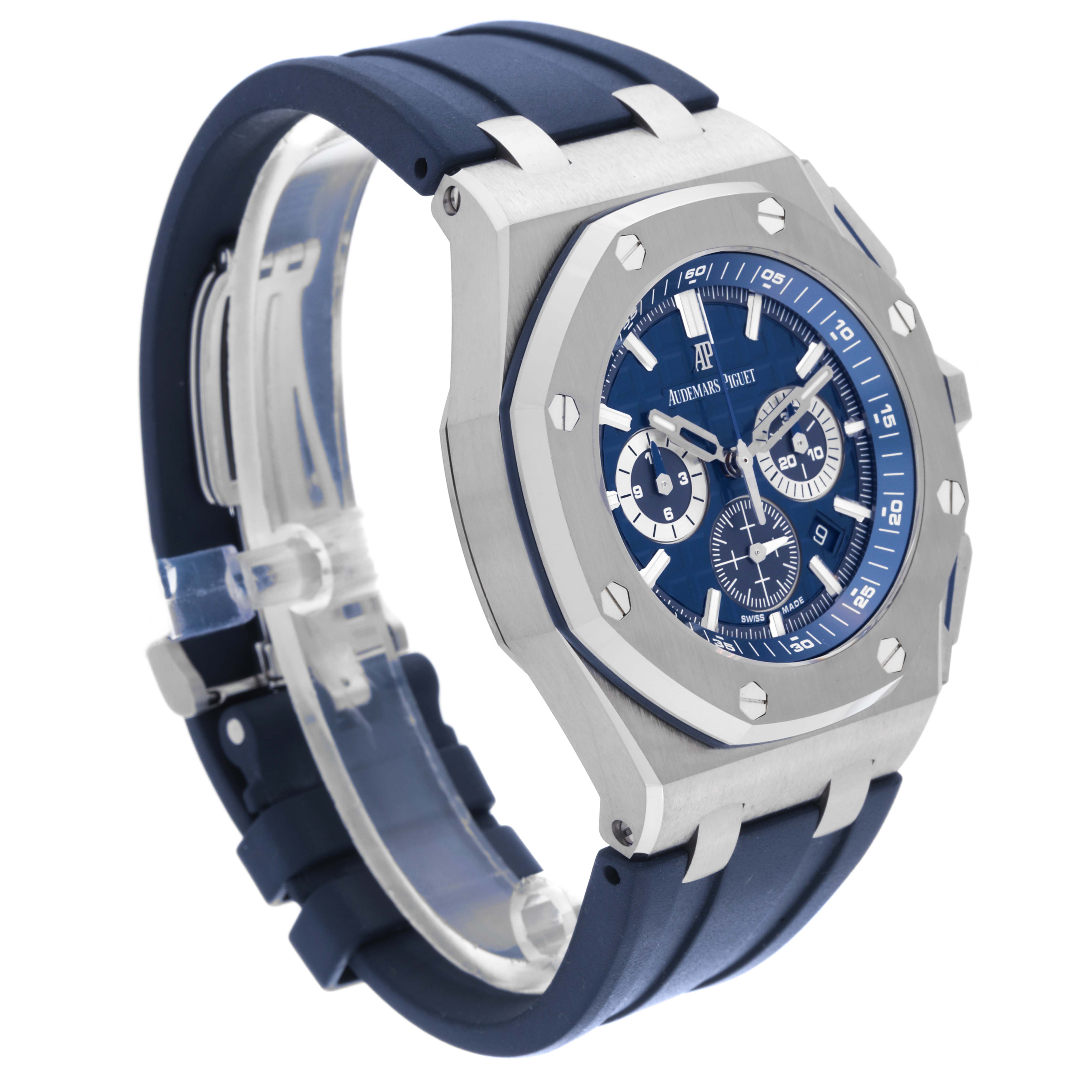 The image shows a side-angle view of an Audemars Piguet Royal Oak 26480TI.OO.A027CA.01 Men's Titanium Blue Dial 26480TI.OO.A027CA.01 Men's Titanium Blue Dial watch with a blue dial and rubber strap.