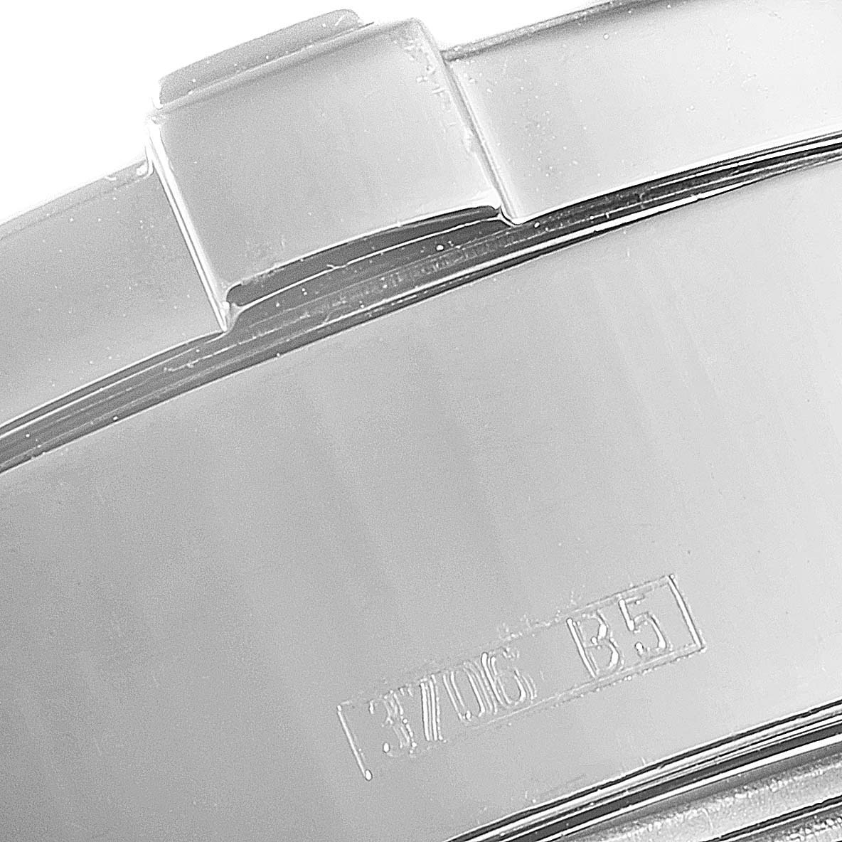 The image shows a close-up of the clasp on a Breitling Superocean A13340 Men's Stainless Steel Beige Dial A13340 Men's Stainless Steel Beige Dial watch, highlighting its metallic finish and engraved markings.