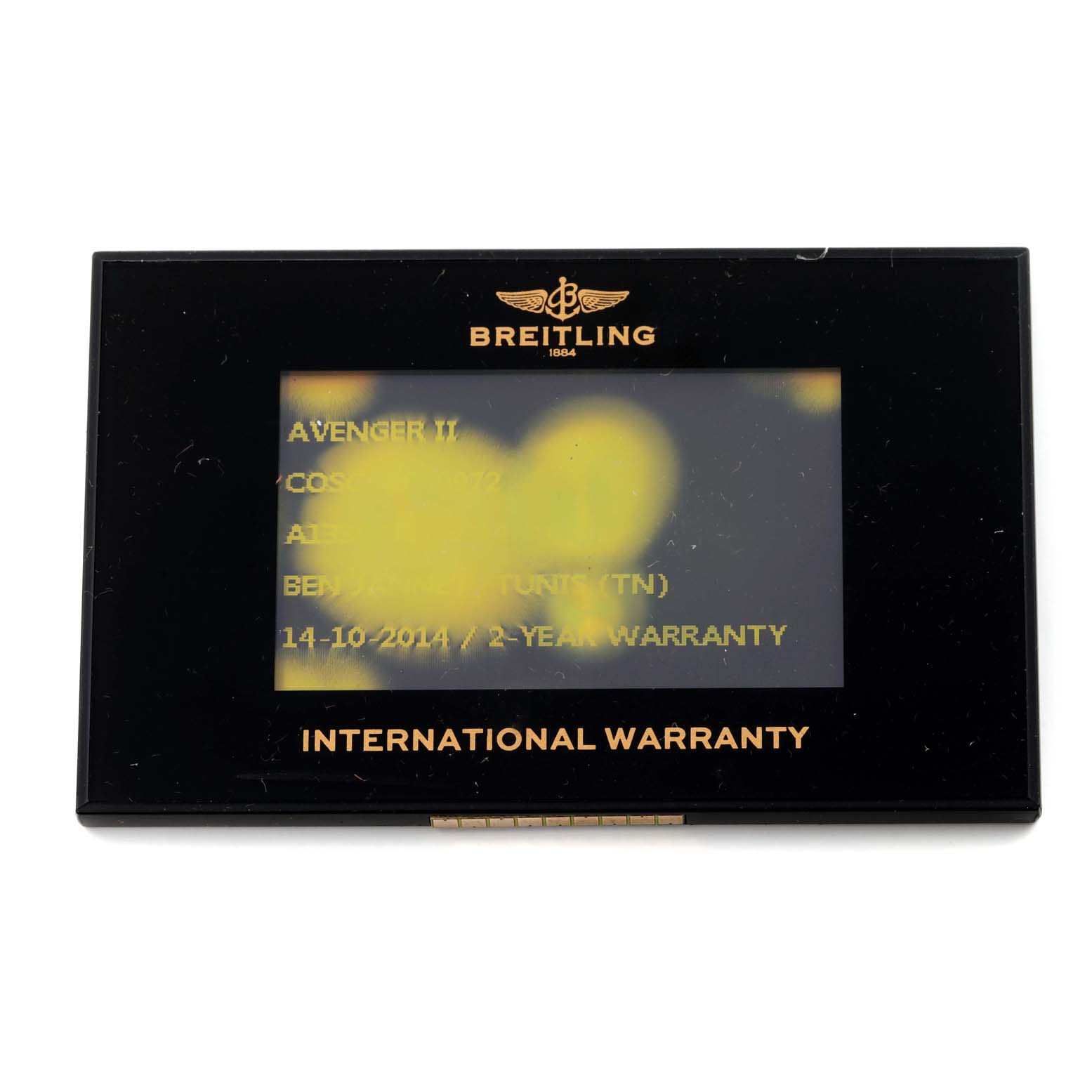 The image shows a Breitling Avenger A13381 Men's Stainless Steel Grey Dial A13381 Men's Stainless Steel Grey Dial II International Warranty card, viewed from the front.