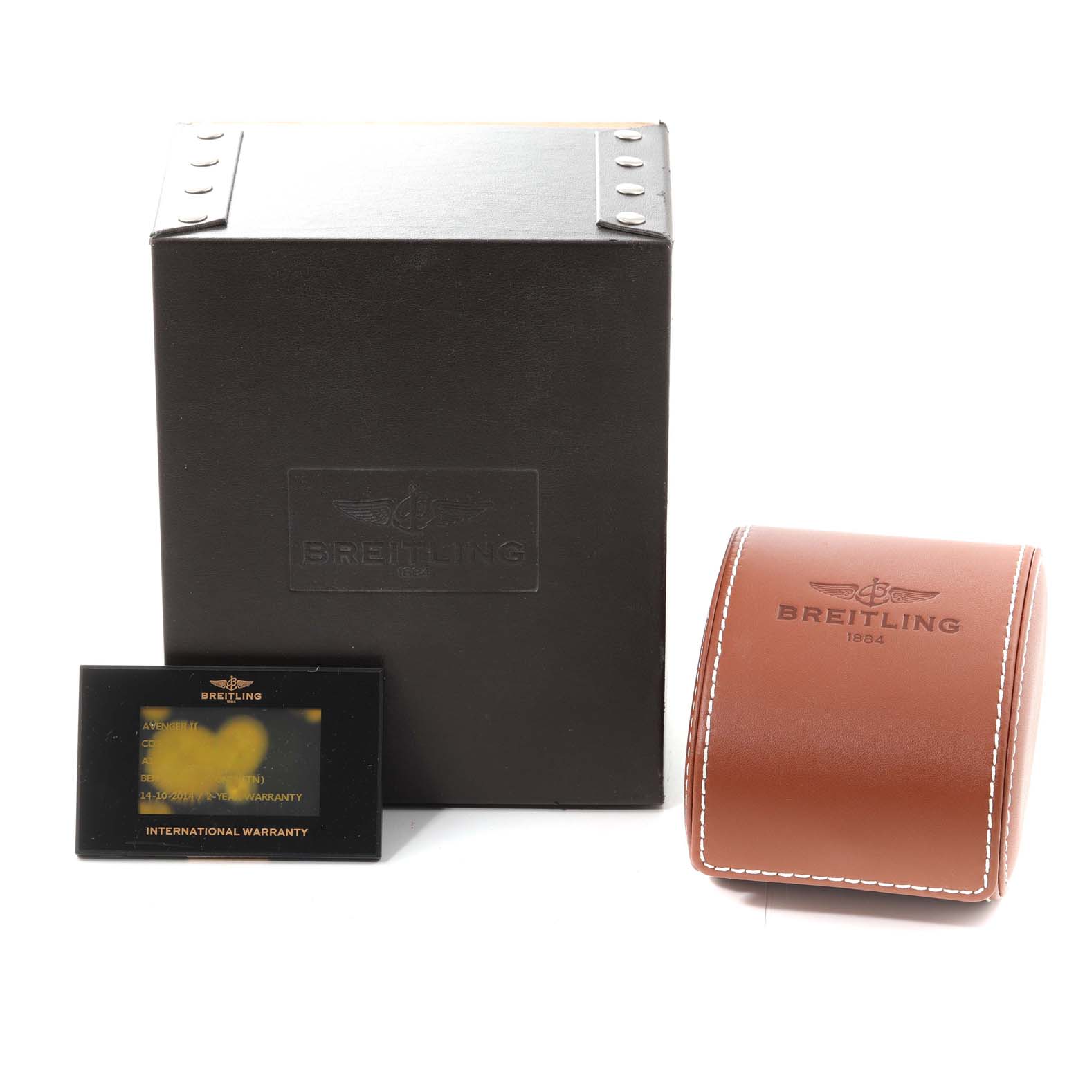 The image shows the packaging, a leather case, and the international warranty card for the Breitling Avenger A13381 Men's Stainless Steel Grey Dial A13381 Men's Stainless Steel Grey Dial watch.