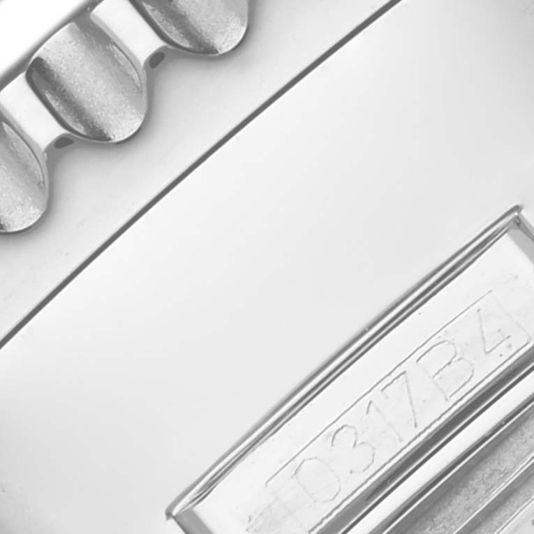 This close-up image shows the crown and part of the caseback with its engraving of a Breitling Navitimer AB012721-C889-453A Men's Stainless Steel Blue Dial AB012721-C889-453A Men's Stainless Steel Blue Dial watch.