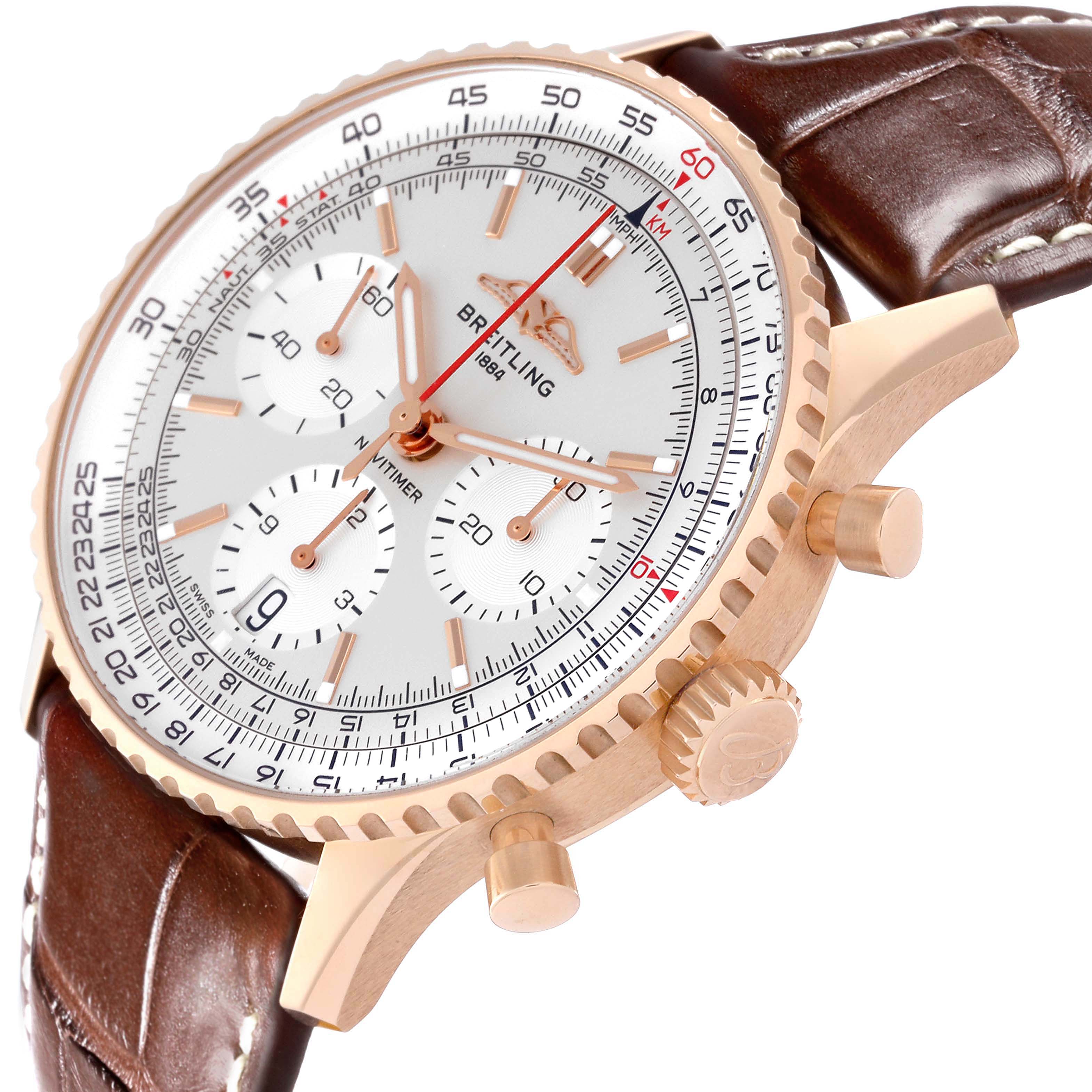 The Breitling Navitimer RB0139 Men's Rose Gold Silver Dial watch is shown at an angle highlighting the side, bezel, crown, pushers, and part of the leather strap.