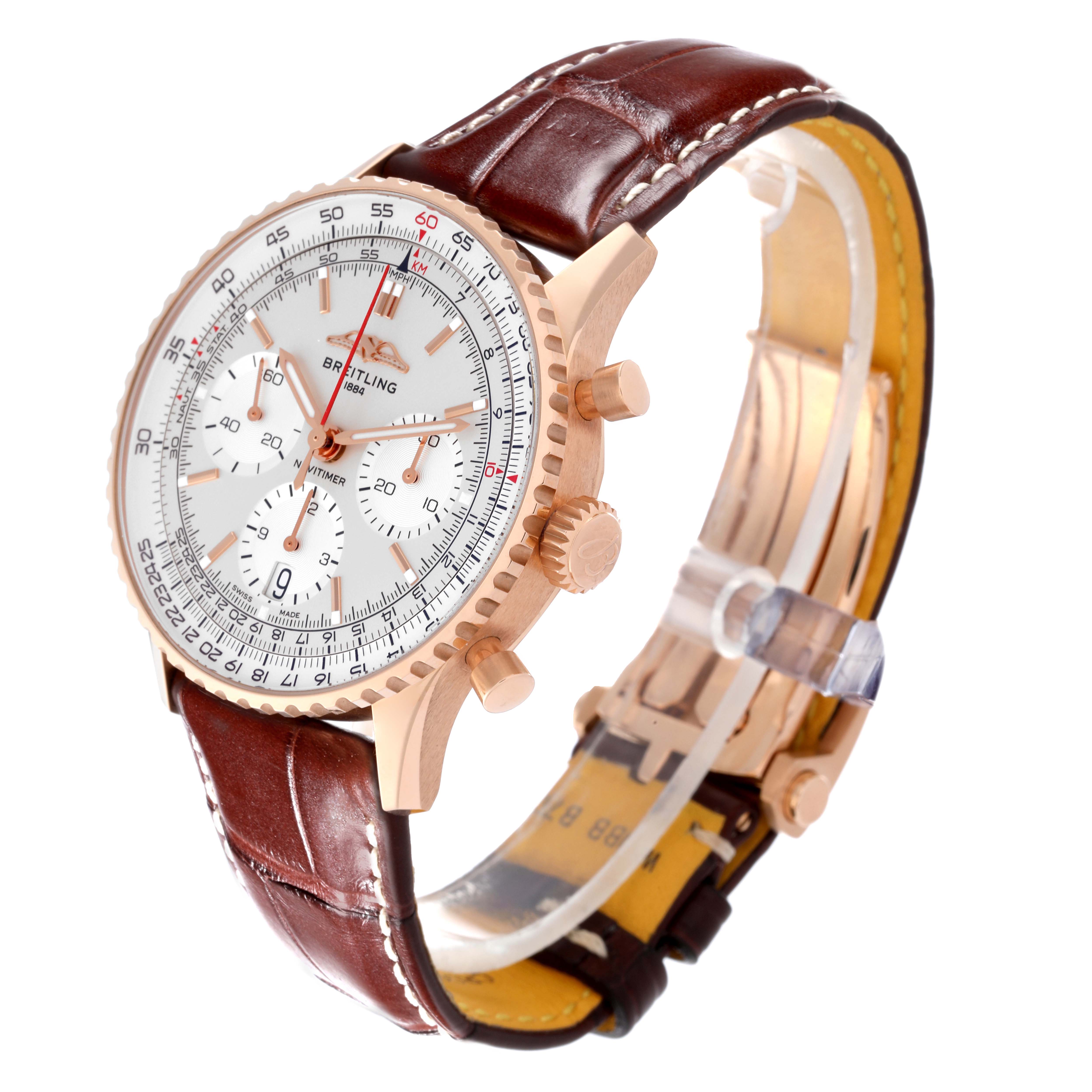 This image shows a side and partial top view of a Breitling Navitimer RB0139 Men's Rose Gold Silver Dial RB0139 Men's Rose Gold Silver Dial watch with a brown leather strap and gold-tone case.