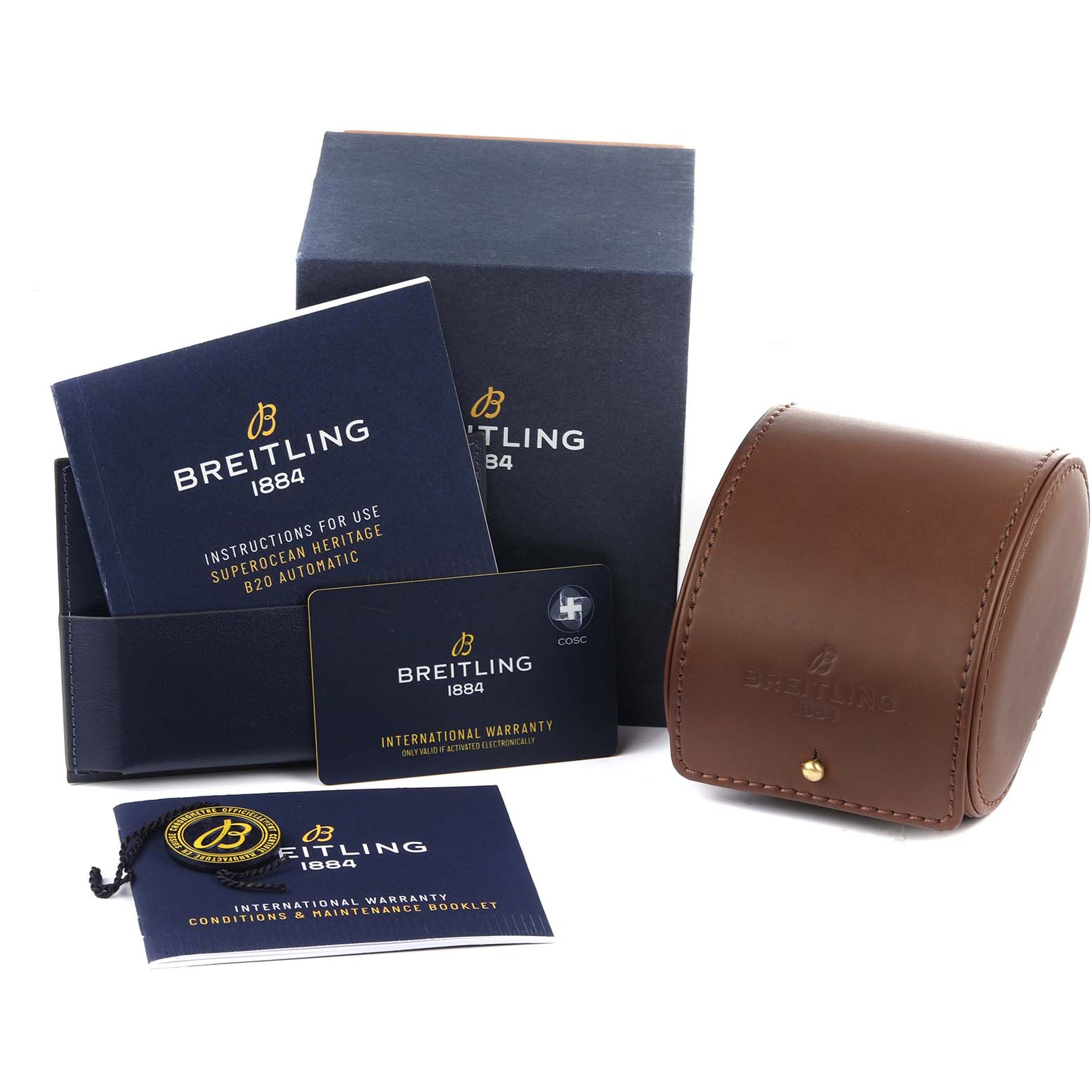 The image shows the Breitling Superocean AB2030 Men's Stainless Steel Blue Dial AB2030 Men's Stainless Steel Blue Dial watch's accessories including instruction booklets, an international warranty card, and a leather case.