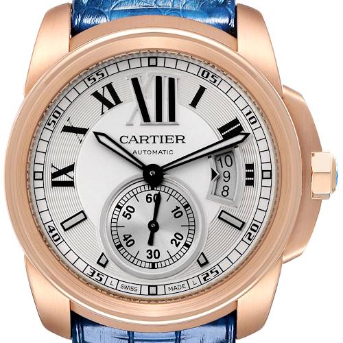 The image shows a frontal view of the Calibre de Cartier watch by Cartier, displaying its face, hands, subdial, and crown.