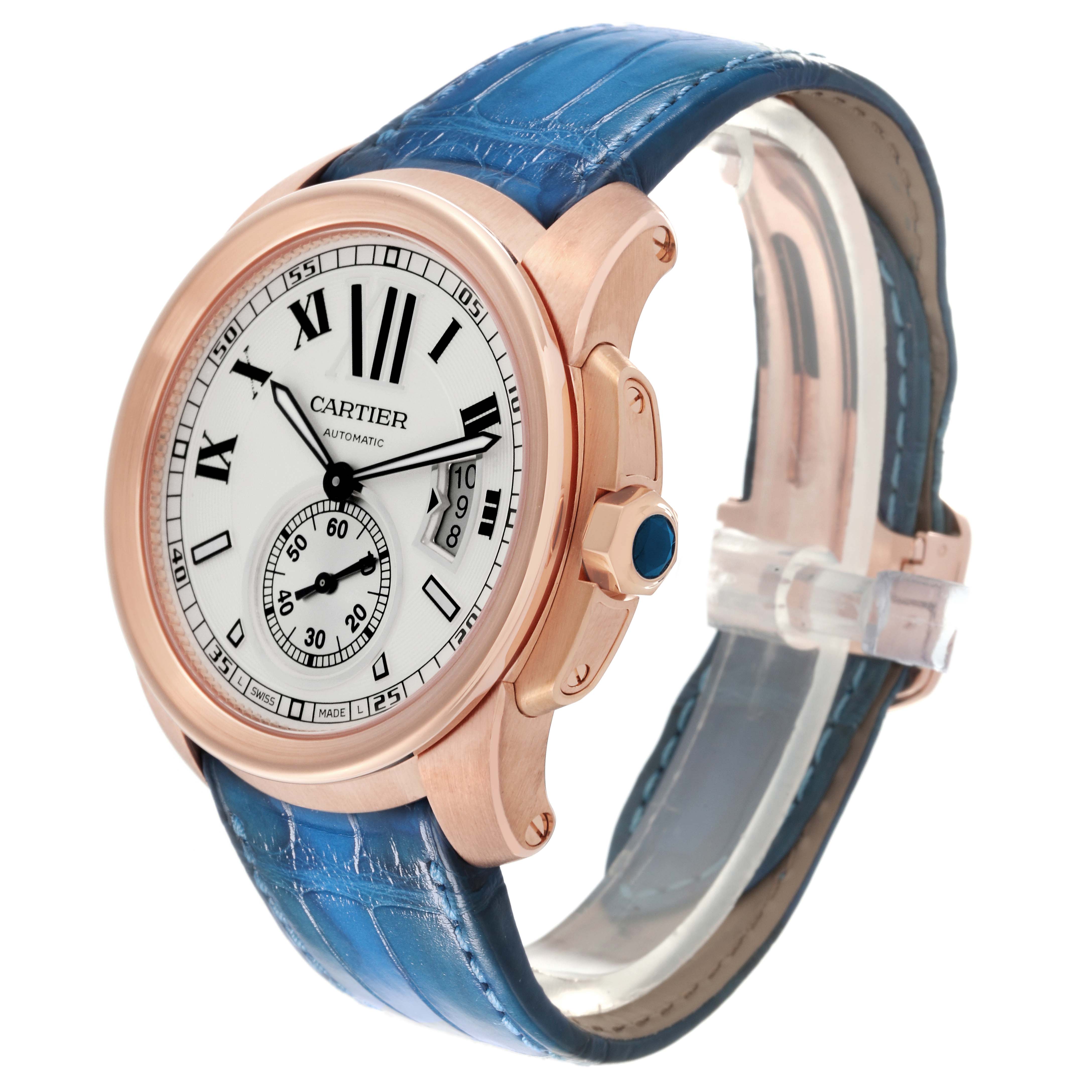The image shows a side angle of the Calibre de Cartier watch by Cartier, highlighting the face, crown, and blue strap.