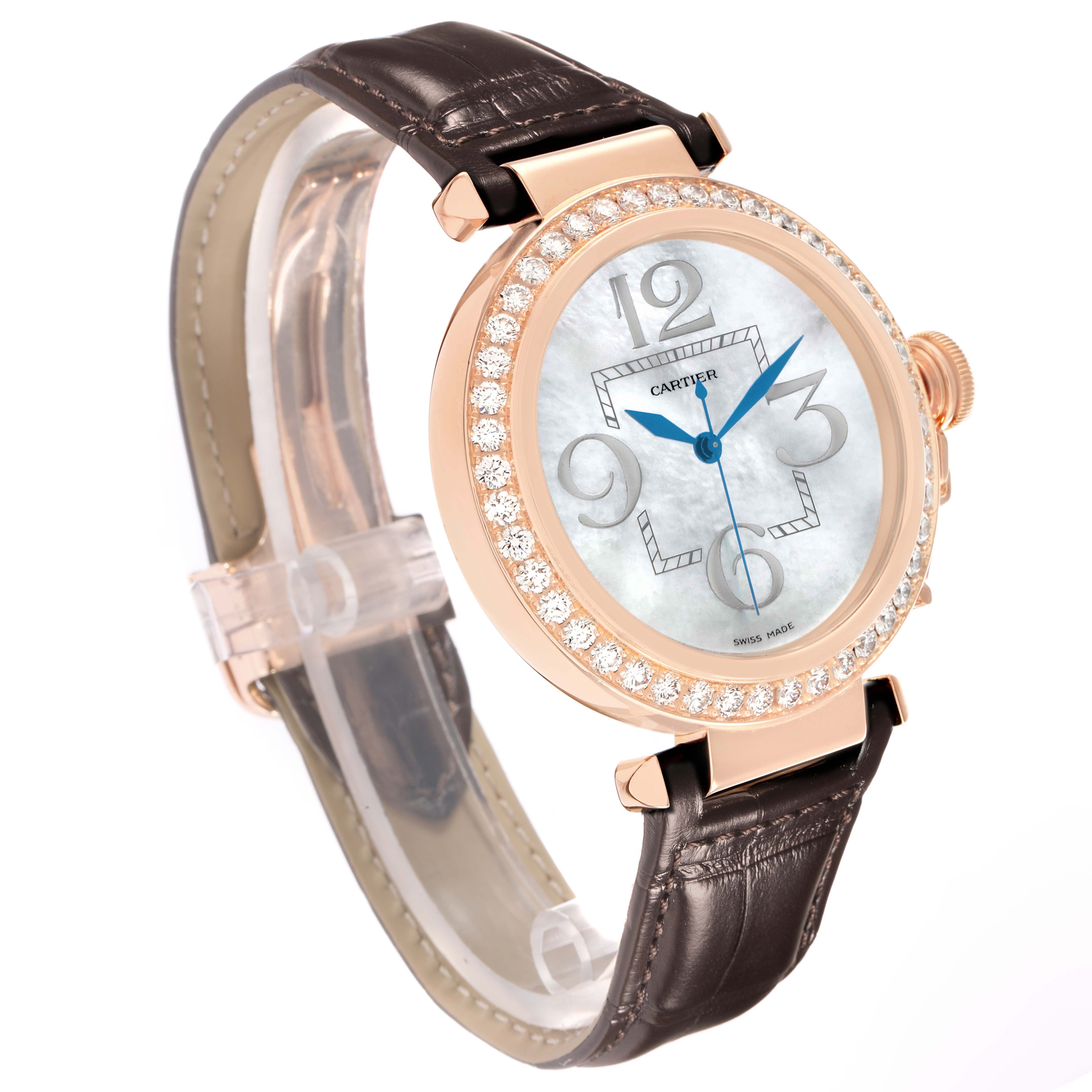 The Cartier Pasha WJ124005 Women
s Rose Gold Mother of Pearl Dial watch is shown at a slight angled view, highlighting its diamond bezel, dial, crown, and leather strap.