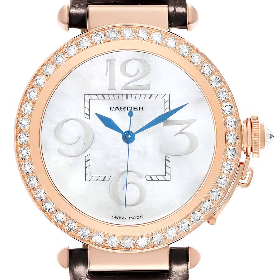 The Cartier Pasha WJ124005 Women's Rose Gold Mother of Pearl Dial watch is shown from a front angle, featuring its diamond bezel, blue hands, and crown with a cabochon.