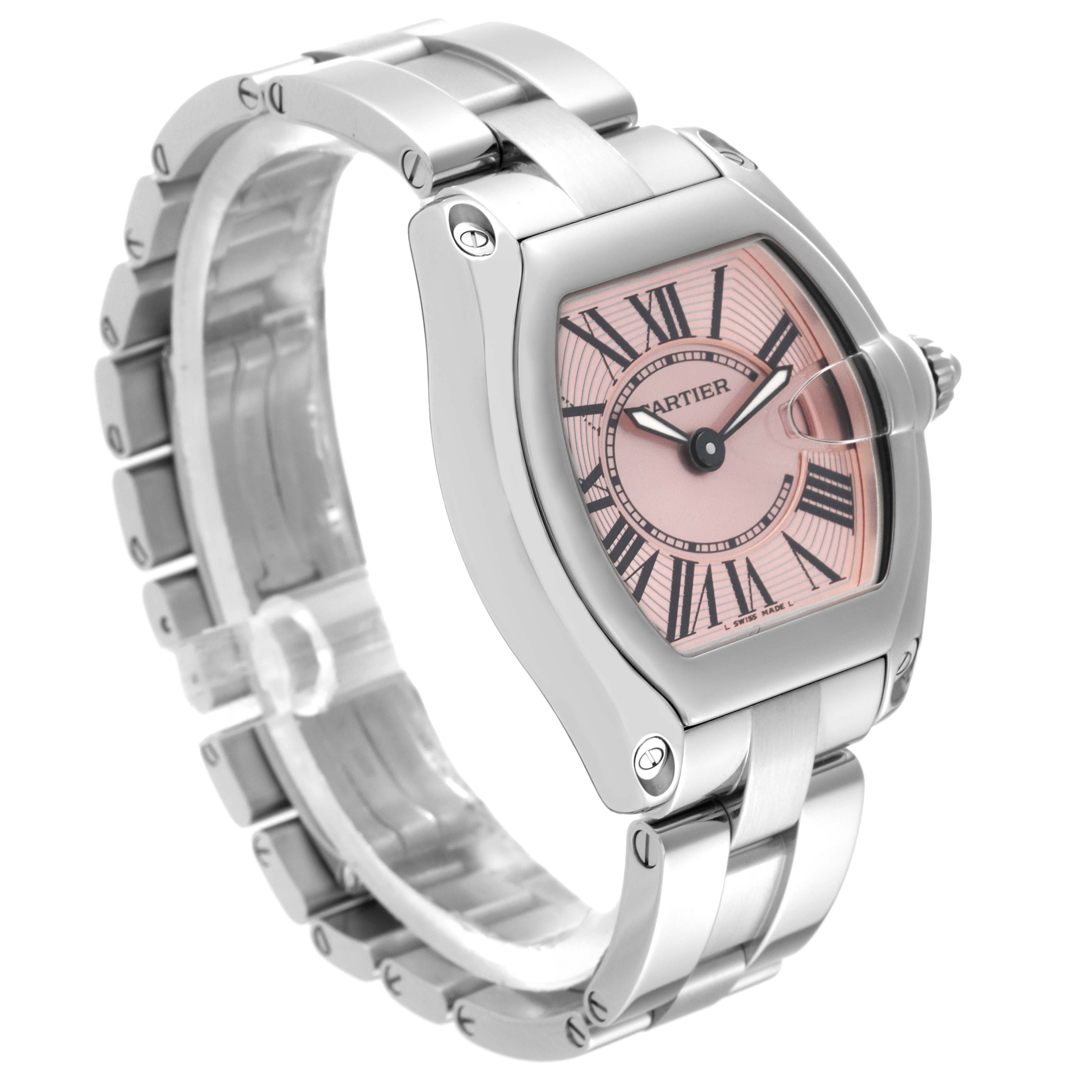 The Cartier Roadster W62017V3 Women's Stainless Steel Pink Dial W62017V3 Women's Stainless Steel Pink Dial watch is shown at an angle highlighting its pink dial, Roman numerals, case, and metal bracelet.