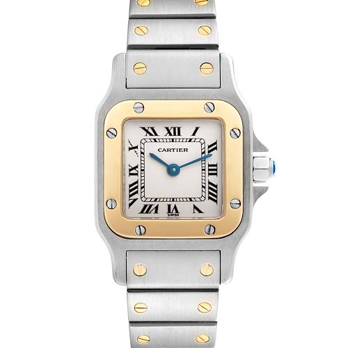 The image shows a front view of a Cartier Santos watch, highlighting the face, bezel, and part of the bracelet.