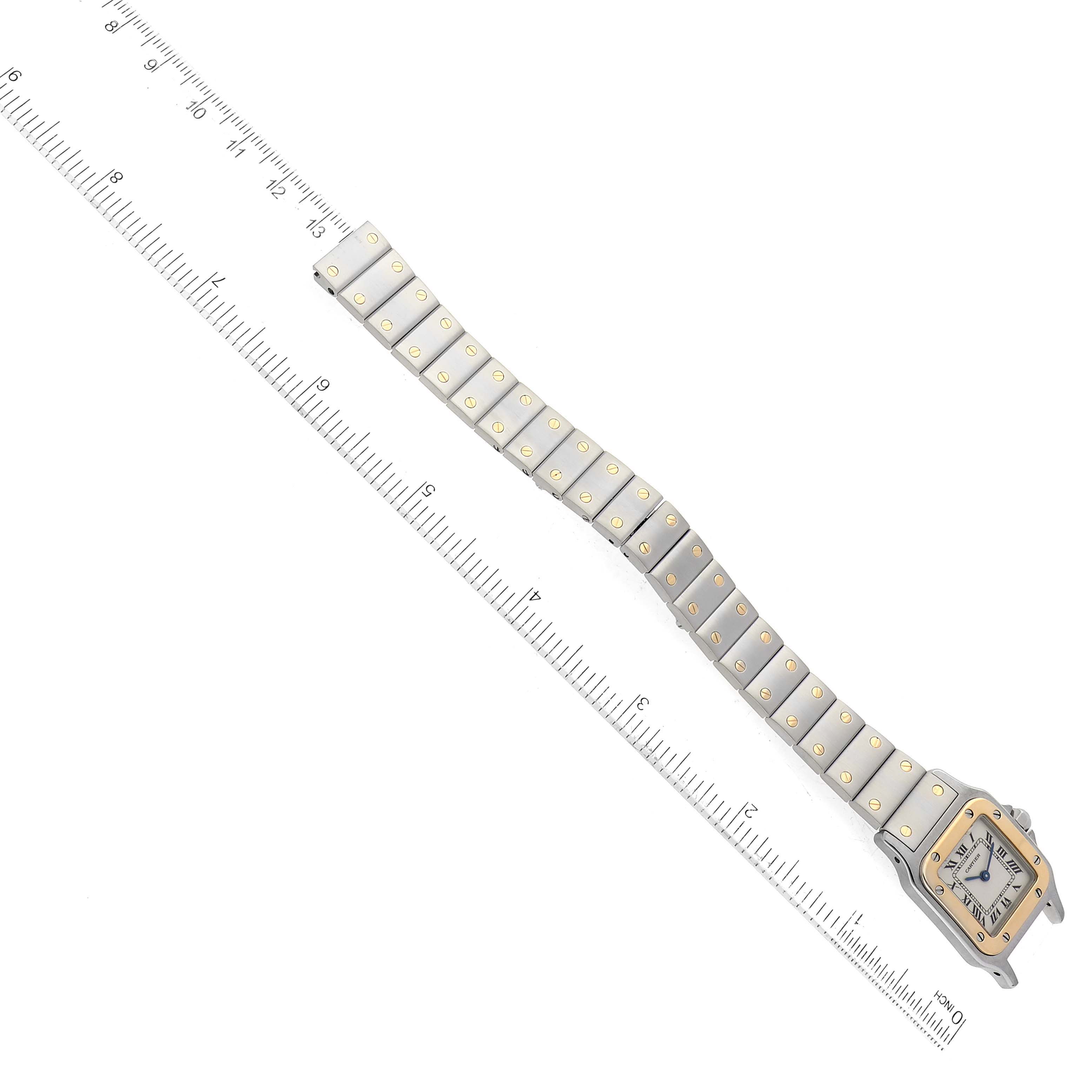 The image shows a Cartier Santos W20012C4 Women's Steel and Gold (two tone) Silver Dial W20012C4 Women's Steel and Gold (two tone) Silver Dial watch from a top-down angle with its face, bezel, and full metal bracelet visible.
