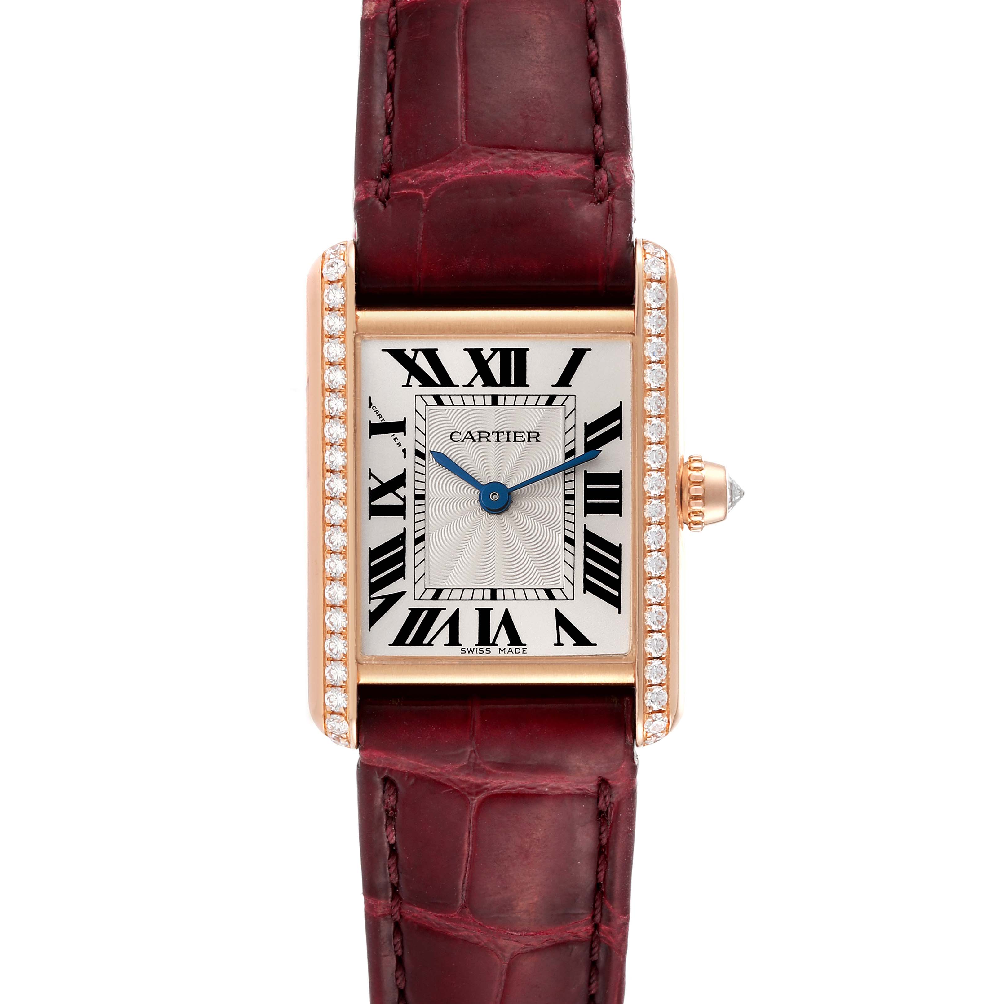 The image shows a Cartier Tank Louis WJTA0010 Women's Rose Gold Silver Dial WJTA0010 Women's Rose Gold Silver Dial watch from a front angle, featuring a gold case, diamond bezel, and a burgundy leather strap.