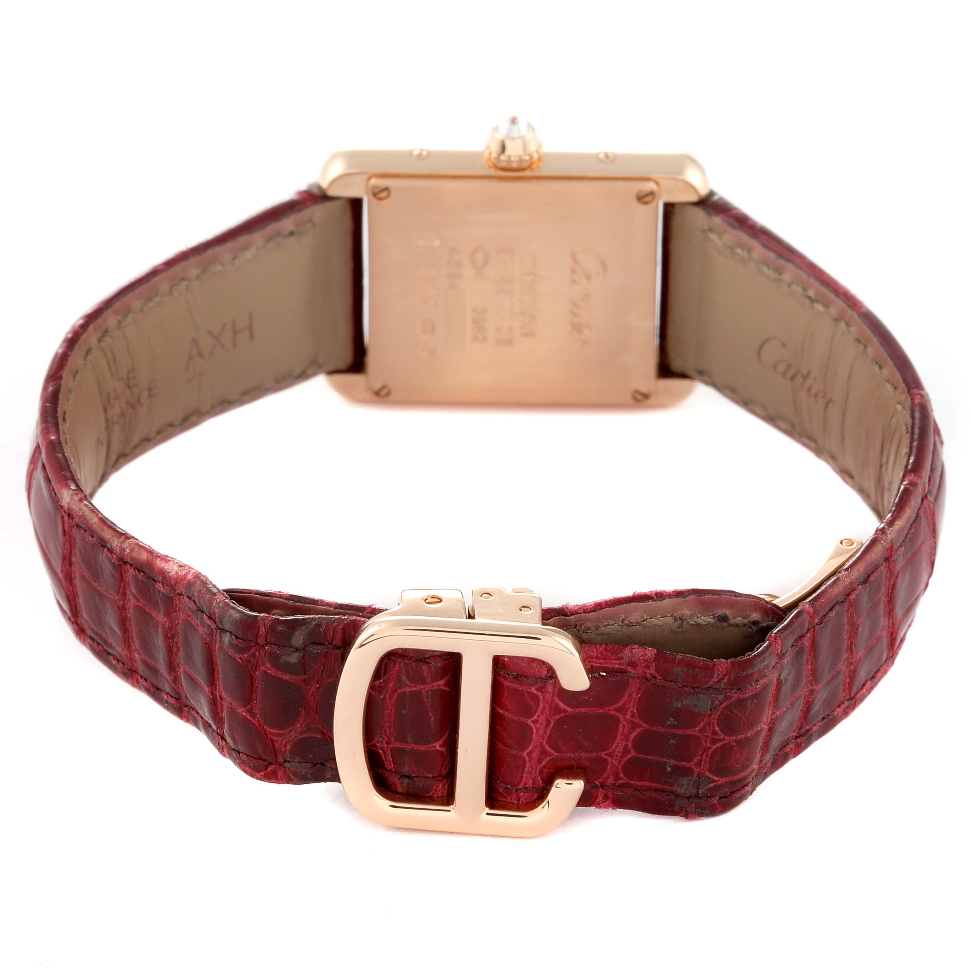 The image shows the back of a Cartier Tank Louis WJTA0010 Women's Rose Gold Silver Dial WJTA0010 Women's Rose Gold Silver Dial watch, highlighting its case, crown, and red leather strap with a "C" buckle.
