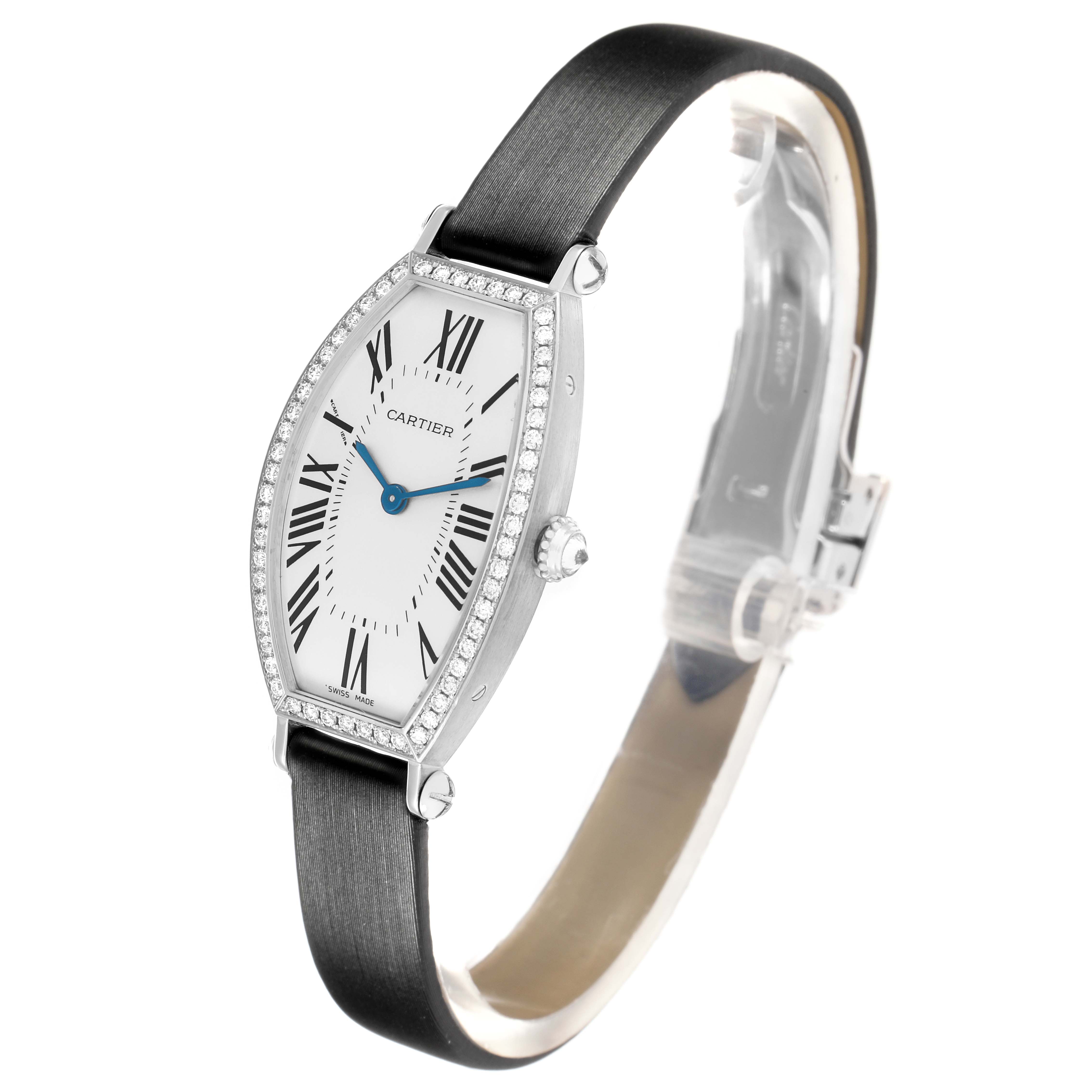 The Cartier Tonneau WE400131 Women
s White Gold Silver Dial watch is shown at a three-quarter angle, highlighting the face, case, crown, and strap.