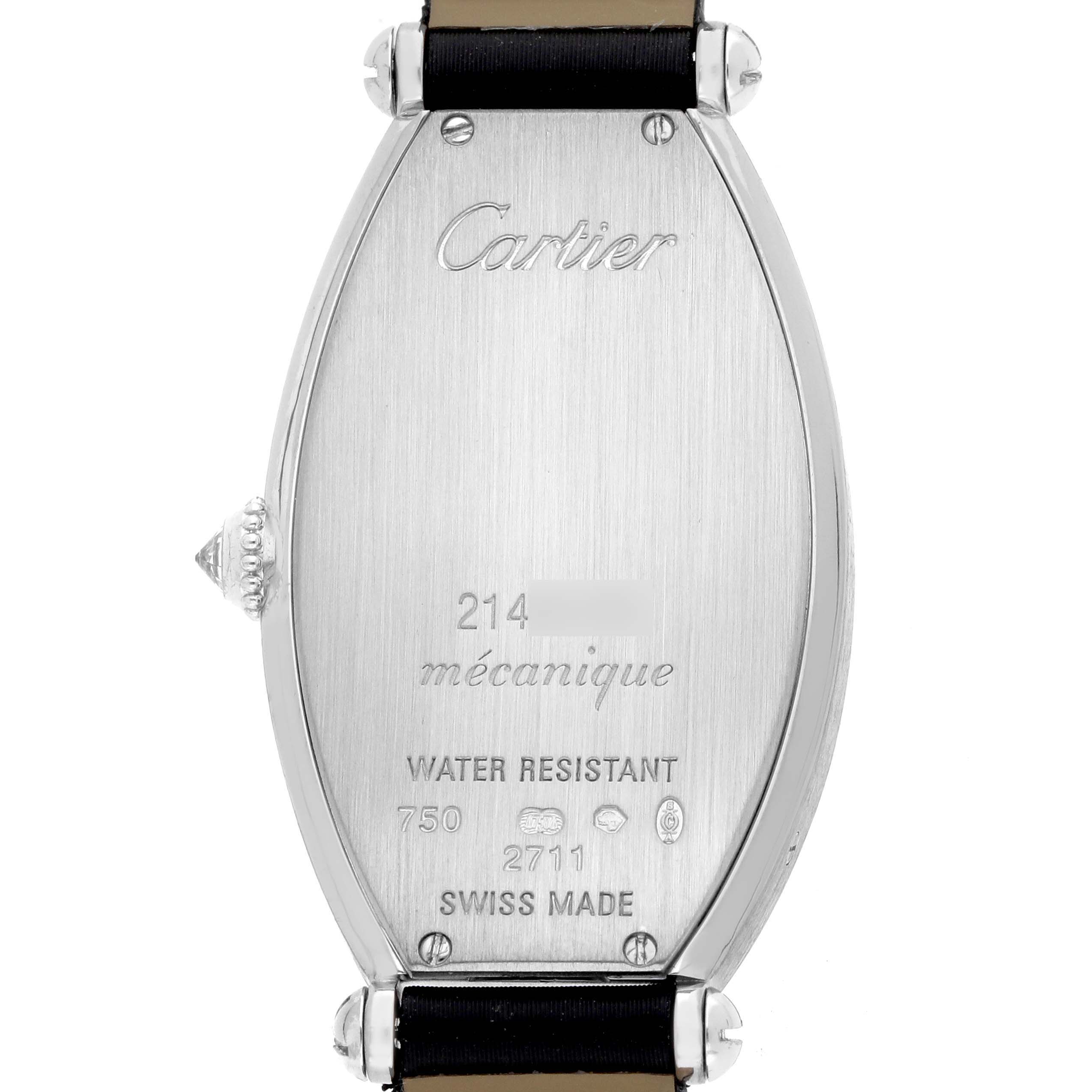 The image shows the back of a Cartier Tonneau WE400131 Women
s White Gold Silver Dial watch, featuring engravings and leather straps.