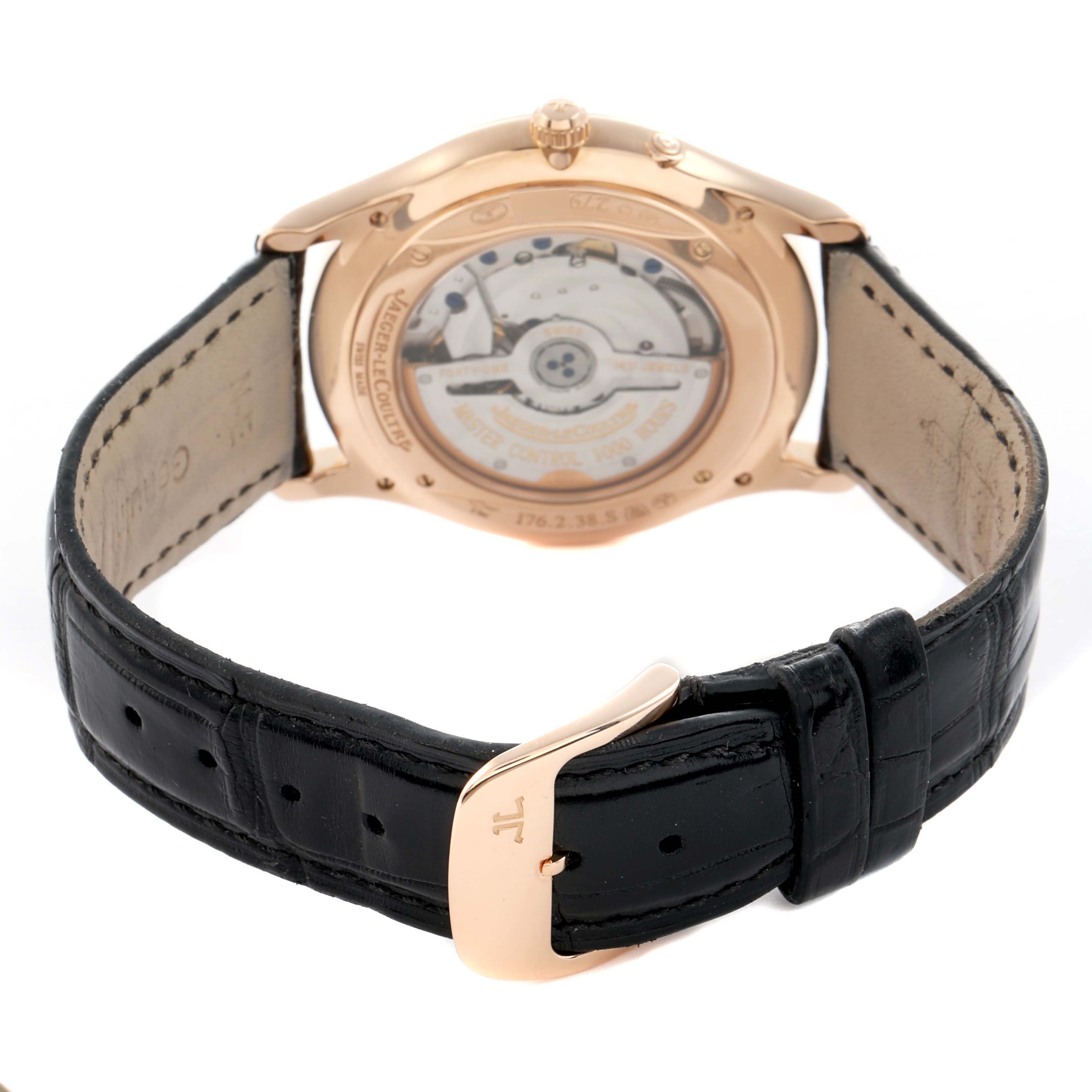The Jaeger LeCoultre Master Q1372520 Men
s Rose Gold Beige Dial watch is shown from the back, highlighting the transparent case back and leather strap.