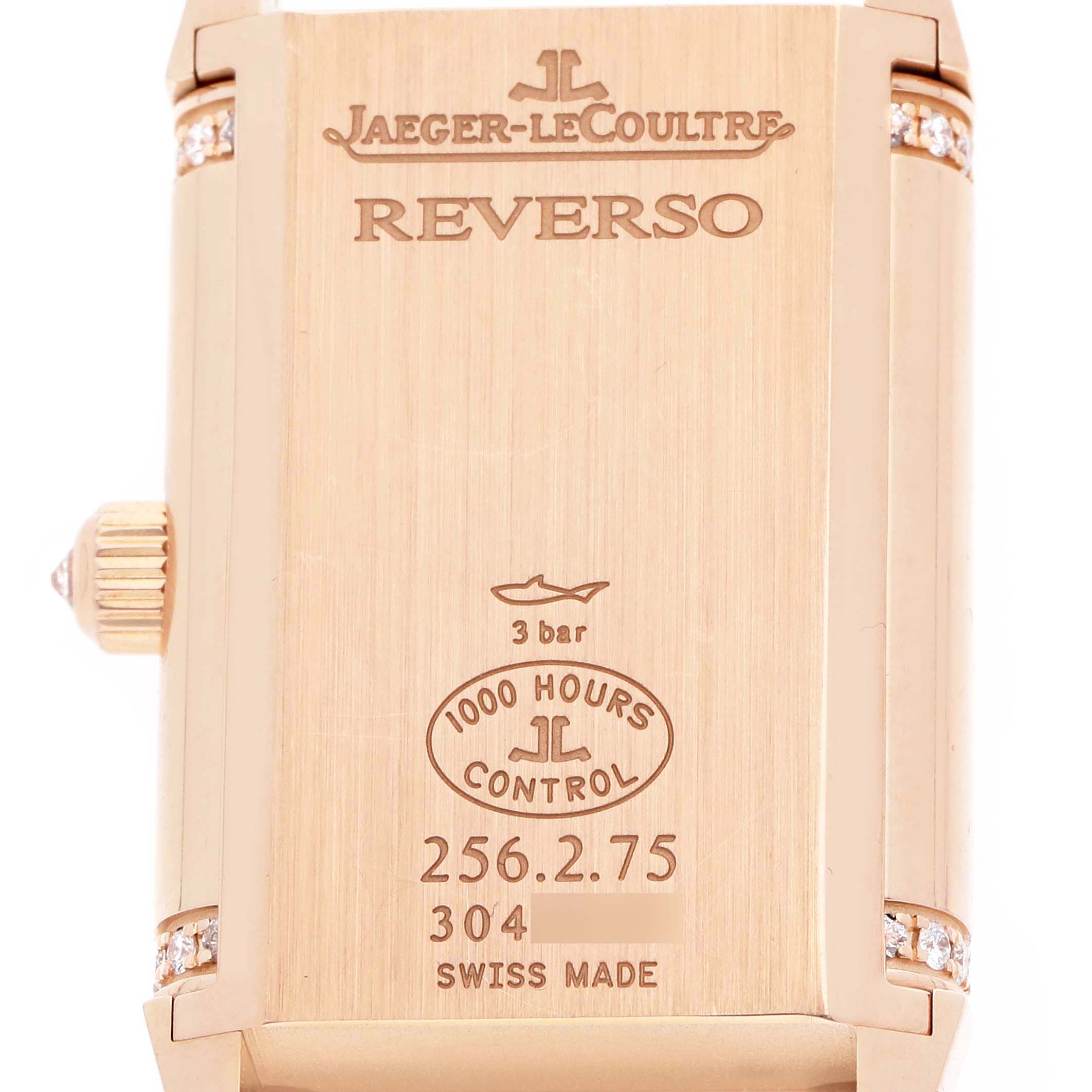 The image shows the back of a Jaeger LeCoultre Reverso Q2562407 Women
s Rose Gold Pink Dial watch, displaying engravings and branding details.