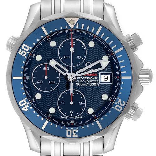 The image shows a close-up of the Omega Seamaster watch's face, displaying the chronograph dials, hands, and bezel.