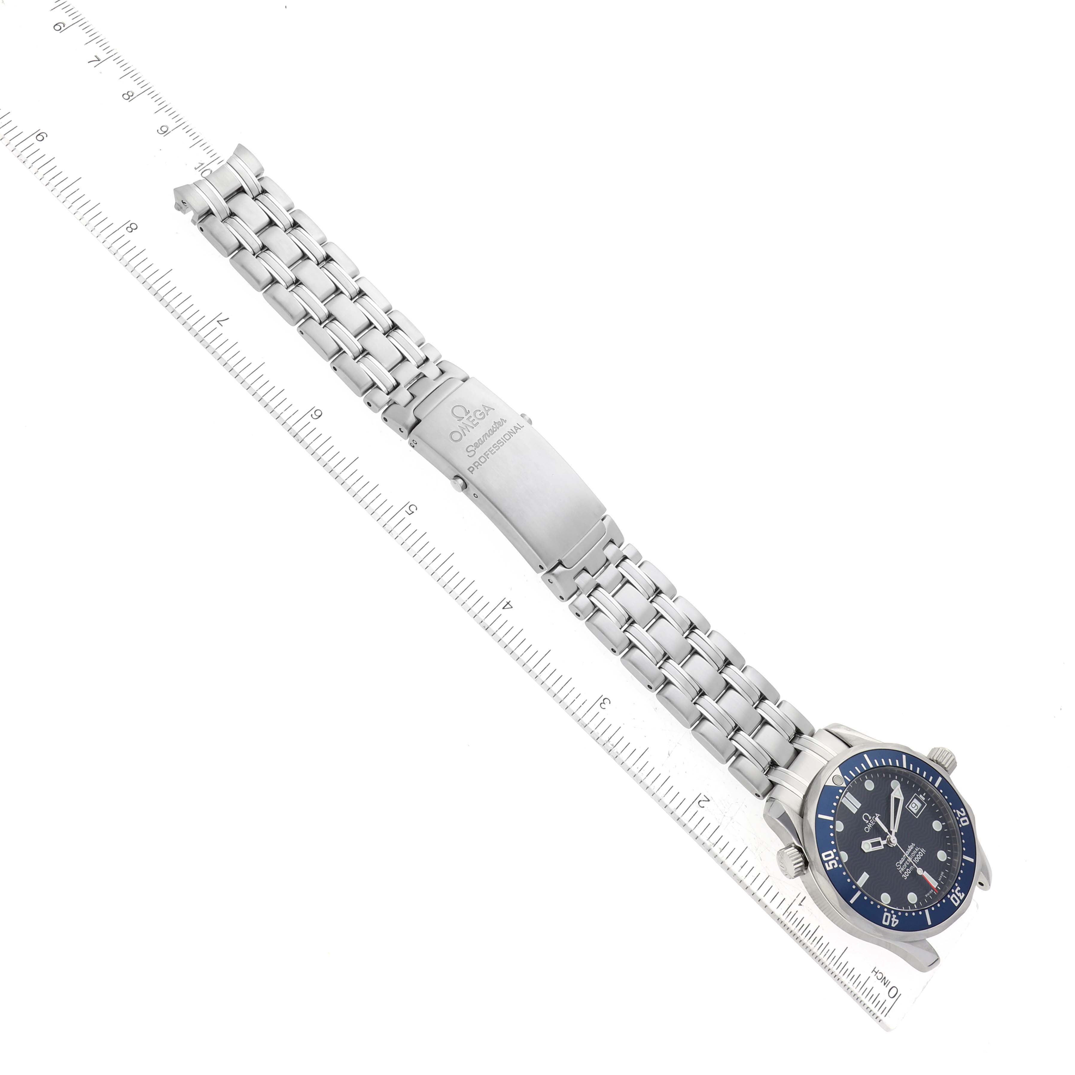 A top-down view of the Omega Seamaster 2561.80.00 Men
s Stainless Steel Blue Dial 2561.80.00 Men
s Stainless Steel Blue Dial watch, showing the full metal bracelet and the dial next to a measuring ruler.