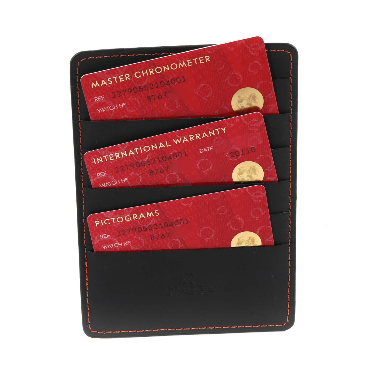 The image shows three red cards labeled "Master Chronometer," "International Warranty," and "Pictograms" for the Omega Ploprof 227.90.55.21.04.001 Men's Titanium White Dial 227.90.55.21.04.001 Men's Titanium White Dial watch, stored in a black cardholder with orange stitching.