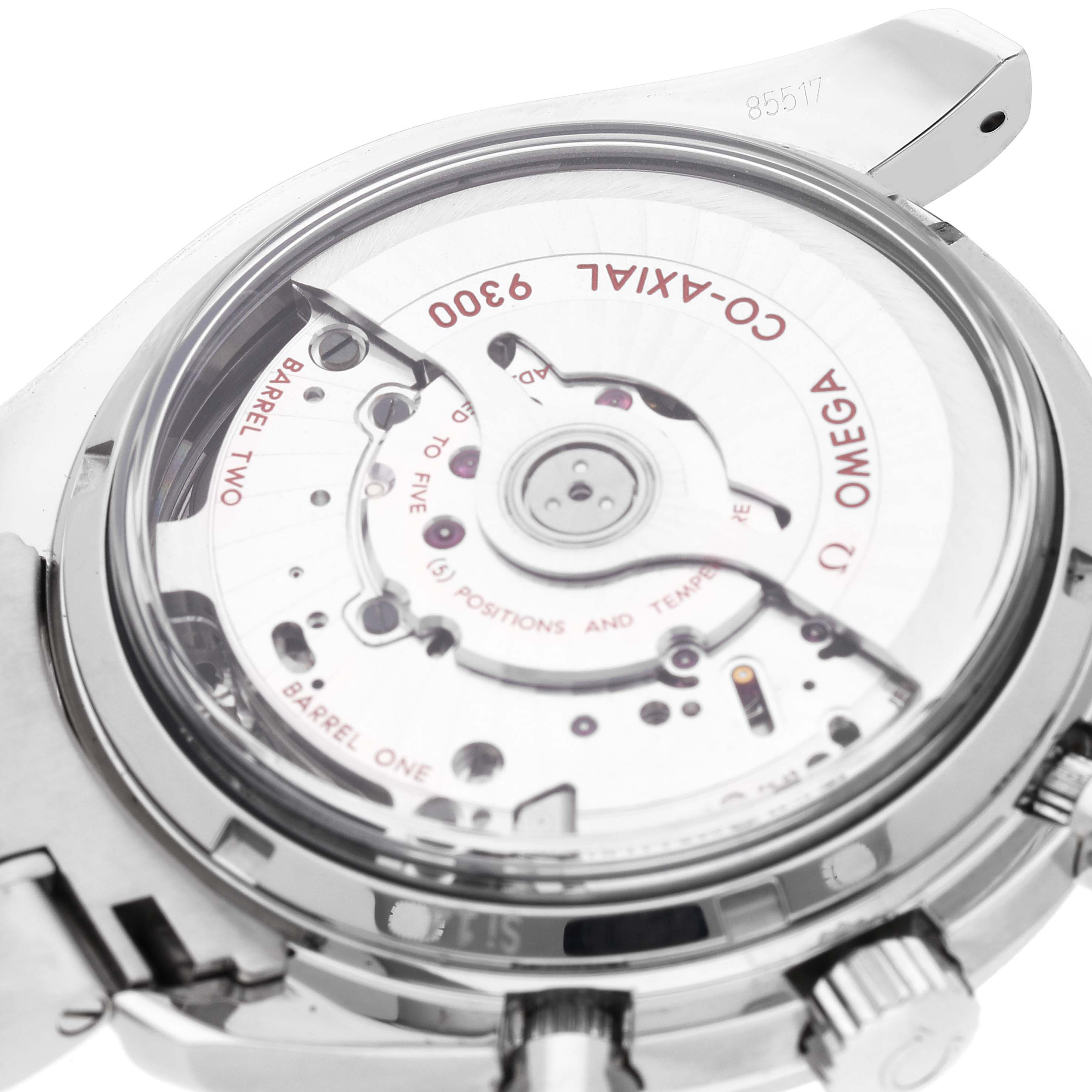 The image shows the back of an Omega Speedmaster 311.30.44.51.01.002 Men
s Stainless Steel Black Dial 311.30.44.51.01.002 Men
s Stainless Steel Black Dial watch focusing on its exposed Co-Axial 9300 movement mechanism.