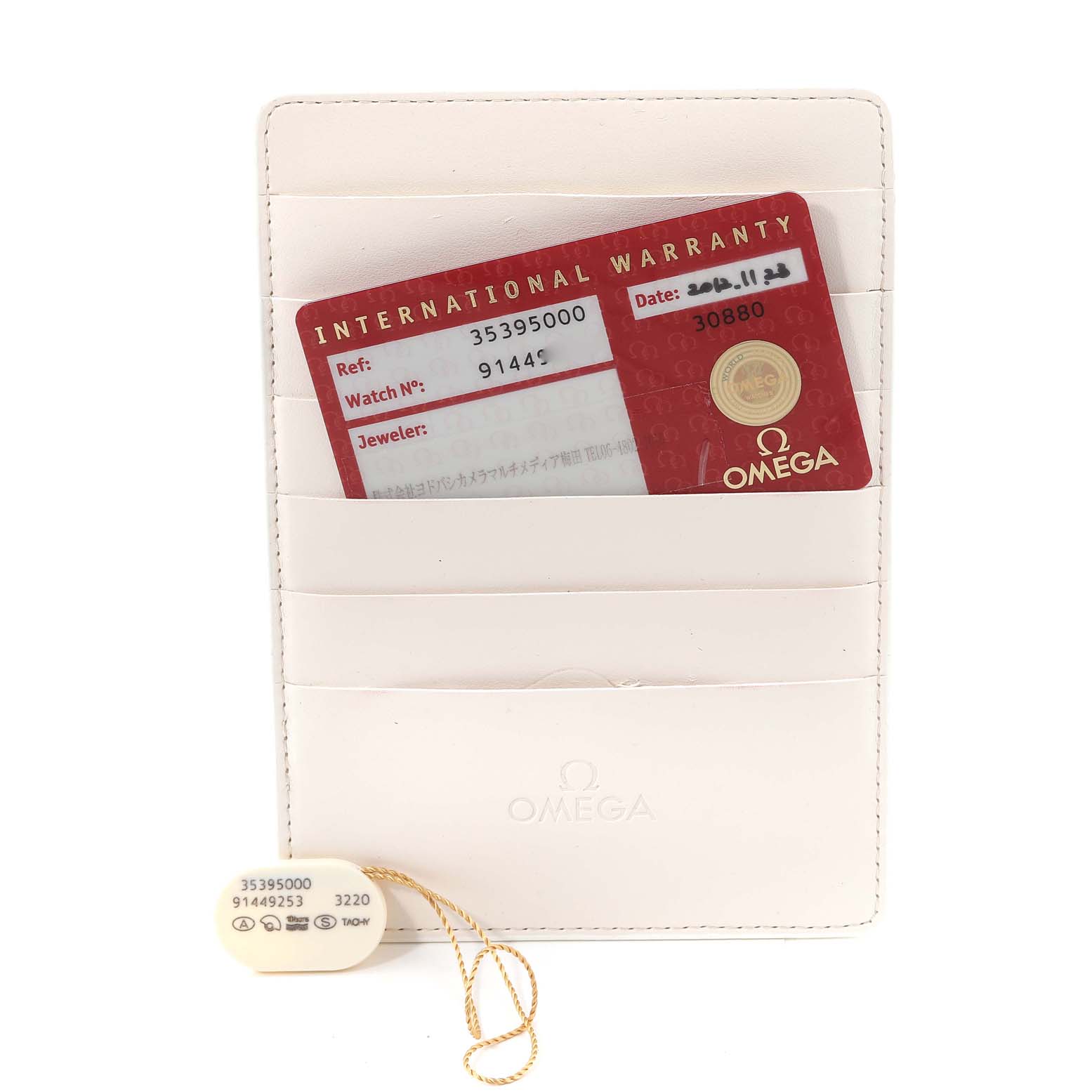 The image shows the warranty card and tag for an Omega Speedmaster 3539.50.00 Men's Stainless Steel Black Dial 3539.50.00 Men's Stainless Steel Black Dial watch.