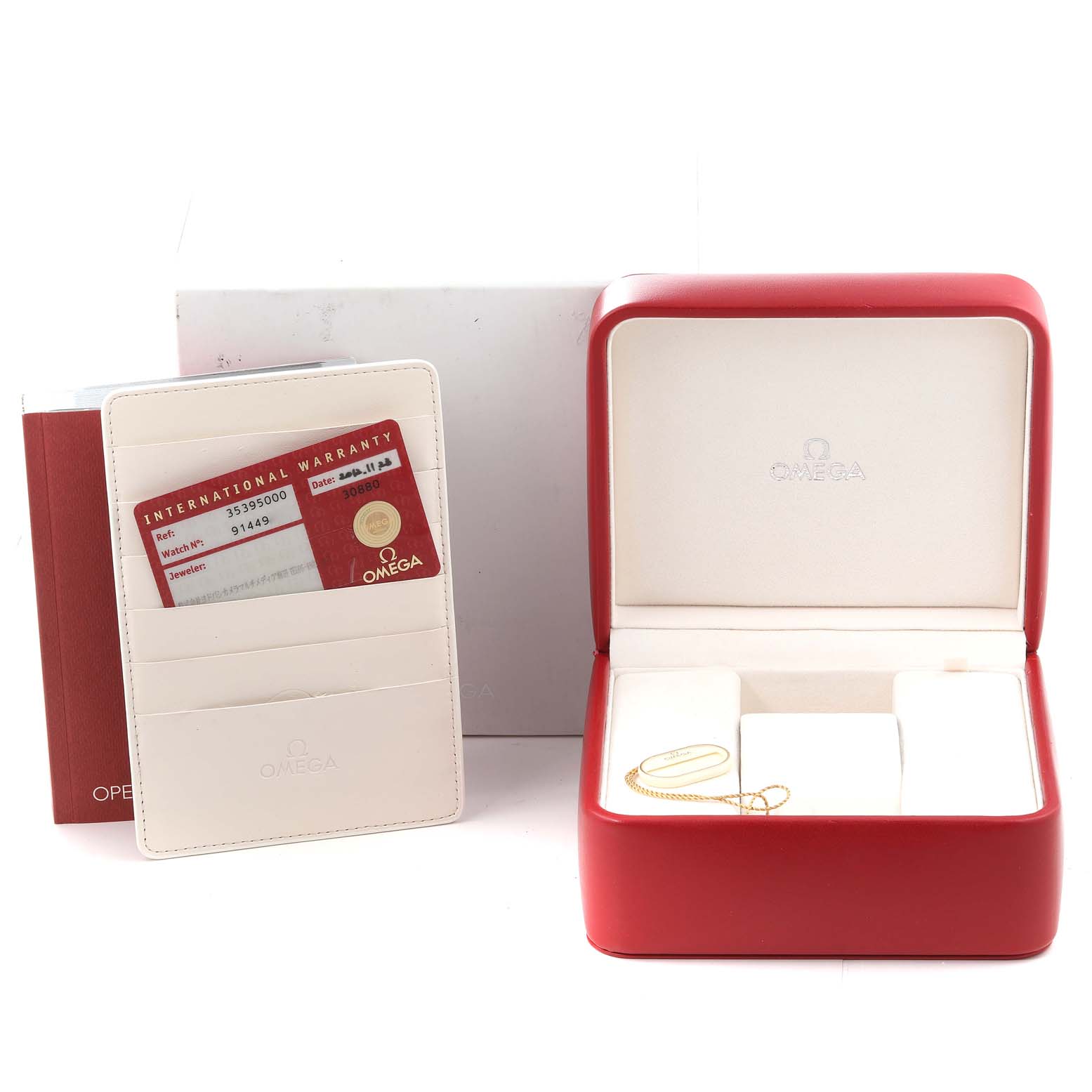 This image shows the packaging, warranty card, and watch case of an Omega Speedmaster 3539.50.00 Men's Stainless Steel Black Dial 3539.50.00 Men's Stainless Steel Black Dial.