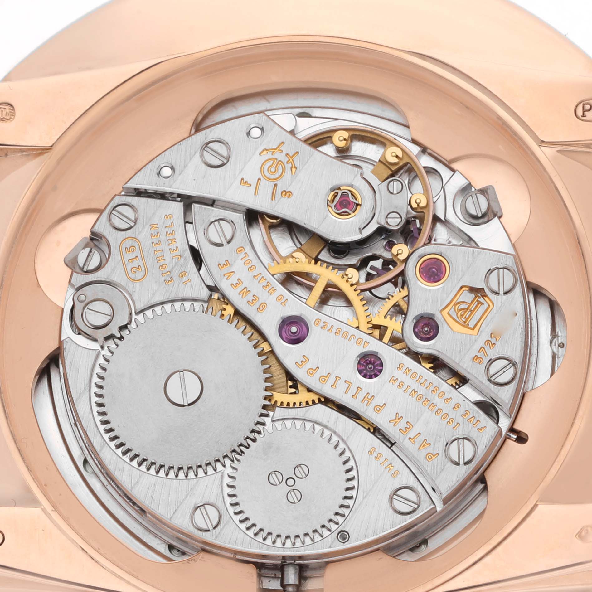 The image shows the intricate movement components of a Patek Philippe Calatrava 5123R Men
s Rose Gold Silver Dial watch from a rear view.