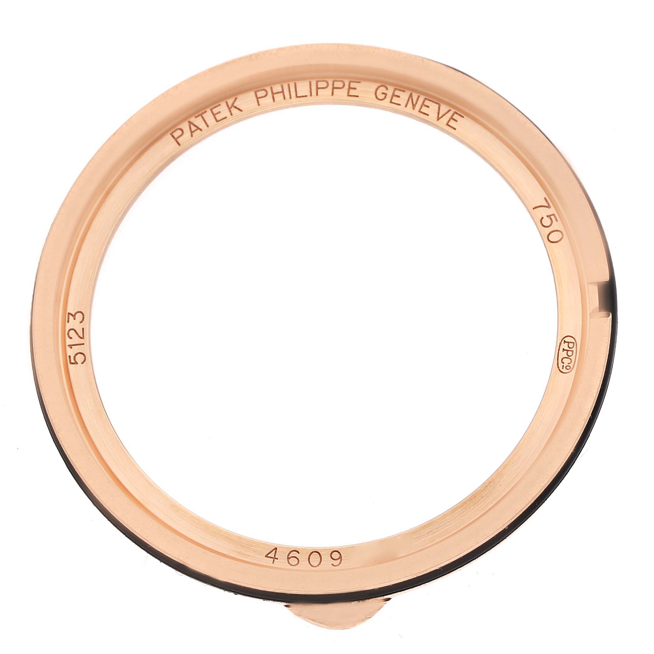 The image shows the bezel of a Patek Philippe Calatrava 5123R Men
s Rose Gold Silver Dial watch, viewed from above, with engravings visible.